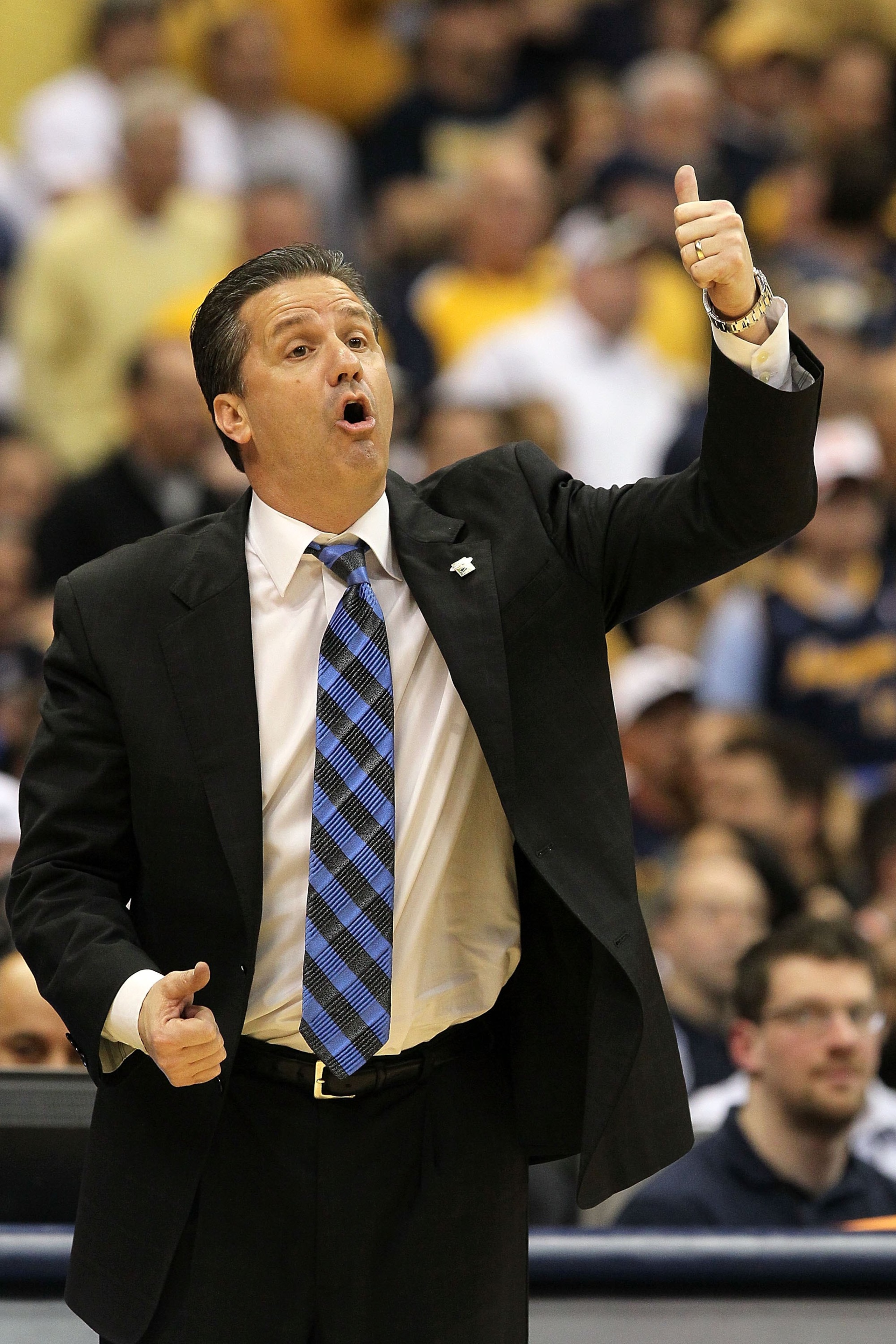 SYRACUSE, NY - MARCH 27:  Head coach John Calipari of the Kentucky Wildcats reacts as he coaches against the West Virginia Mountaineers during the east regional final of the 2010 NCAA men's basketball tournament at the Carrier Dome on March 27, 2010 in Sy