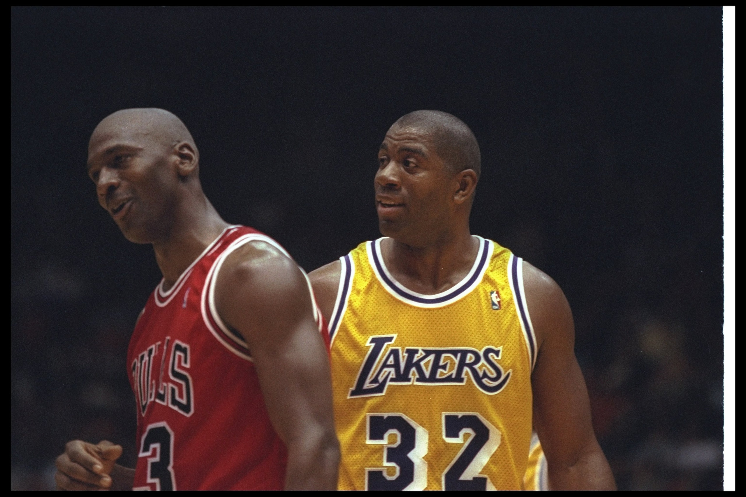 2 Feb 1996:  Guard Earvin (Magic) Johnson of the Los Angeles Lakers confers with Chicago Bulls guard Michael Jordan during a game at the Great Western Forum in Inglewood, California.  The Bulls won the game, 99-84. Mandatory Credit: ALLSPORT USA  /Allspor
