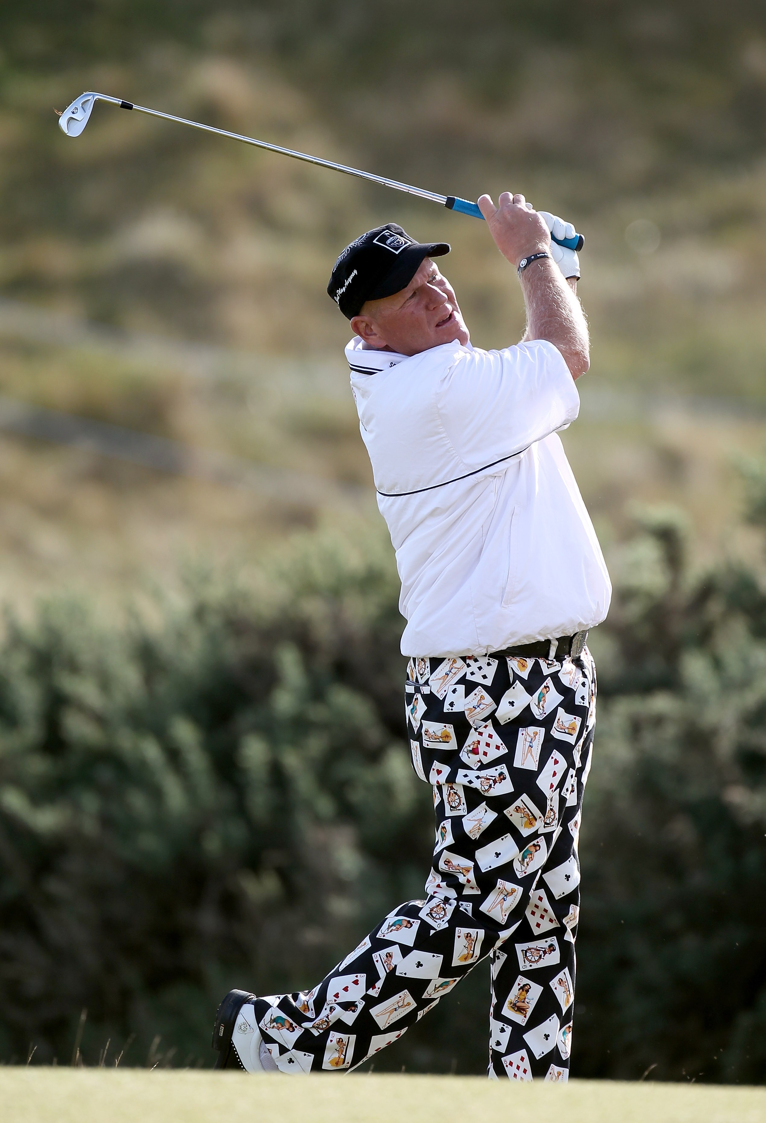 KINGSBARNS, SCOTLAND - OCTOBER 07:  John Daly of the USA plays his second shot to the nineth hole during the first round of The Alfred Dunhill Links Championship at Kingsbarns Golf Links on October 7, 2010 in Kingsbarns, Scotland.  (Photo by Ross Kinnaird