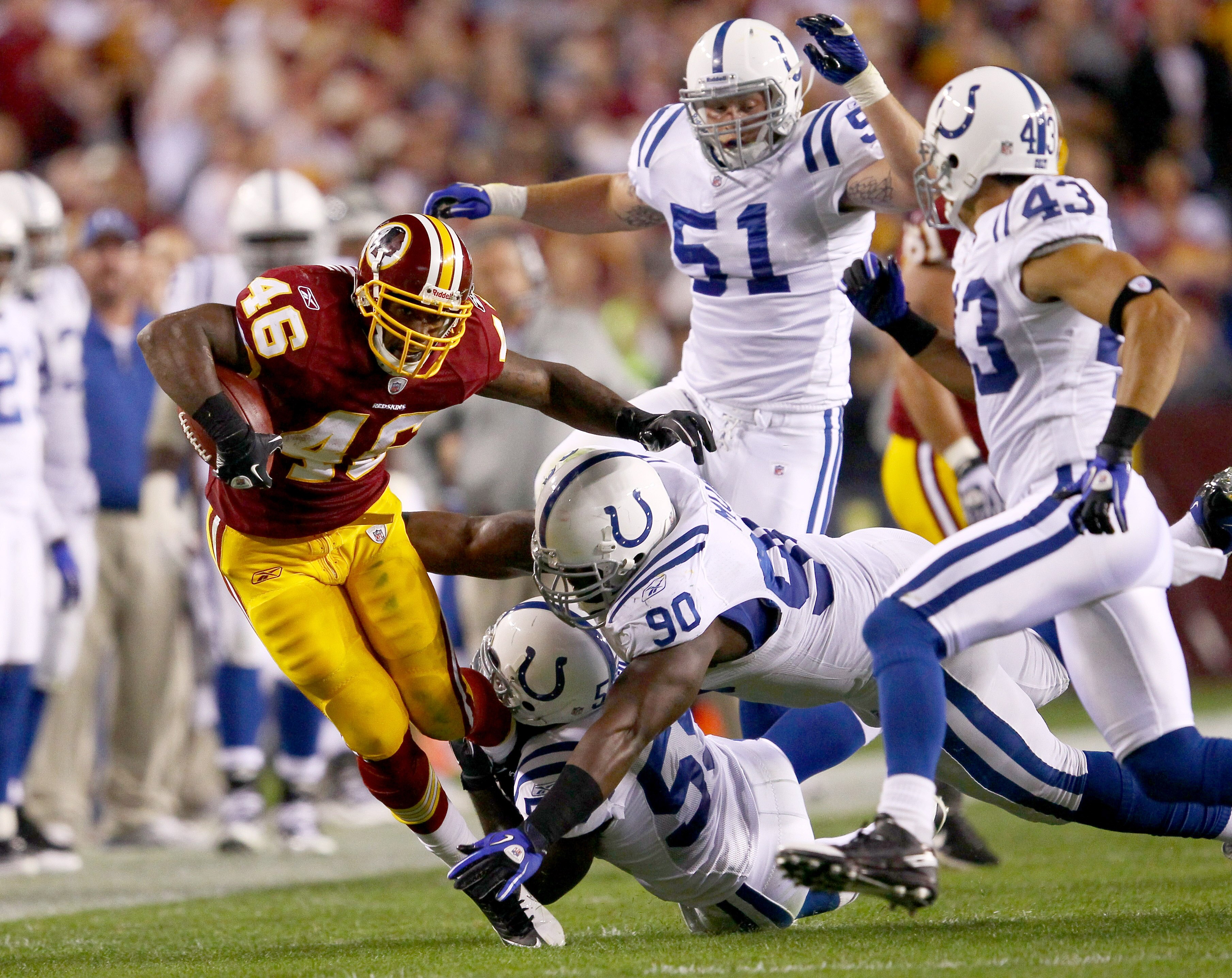 LANDOVER, MD - OCTOBER 17:  Running back Ryan Torain #46 of the Washington Redskins is gang tackled by the Indianapolis Colts defense at FedExField on October 17, 2010 in Landover, Maryland.  (Photo by Win McNamee/Getty Images)