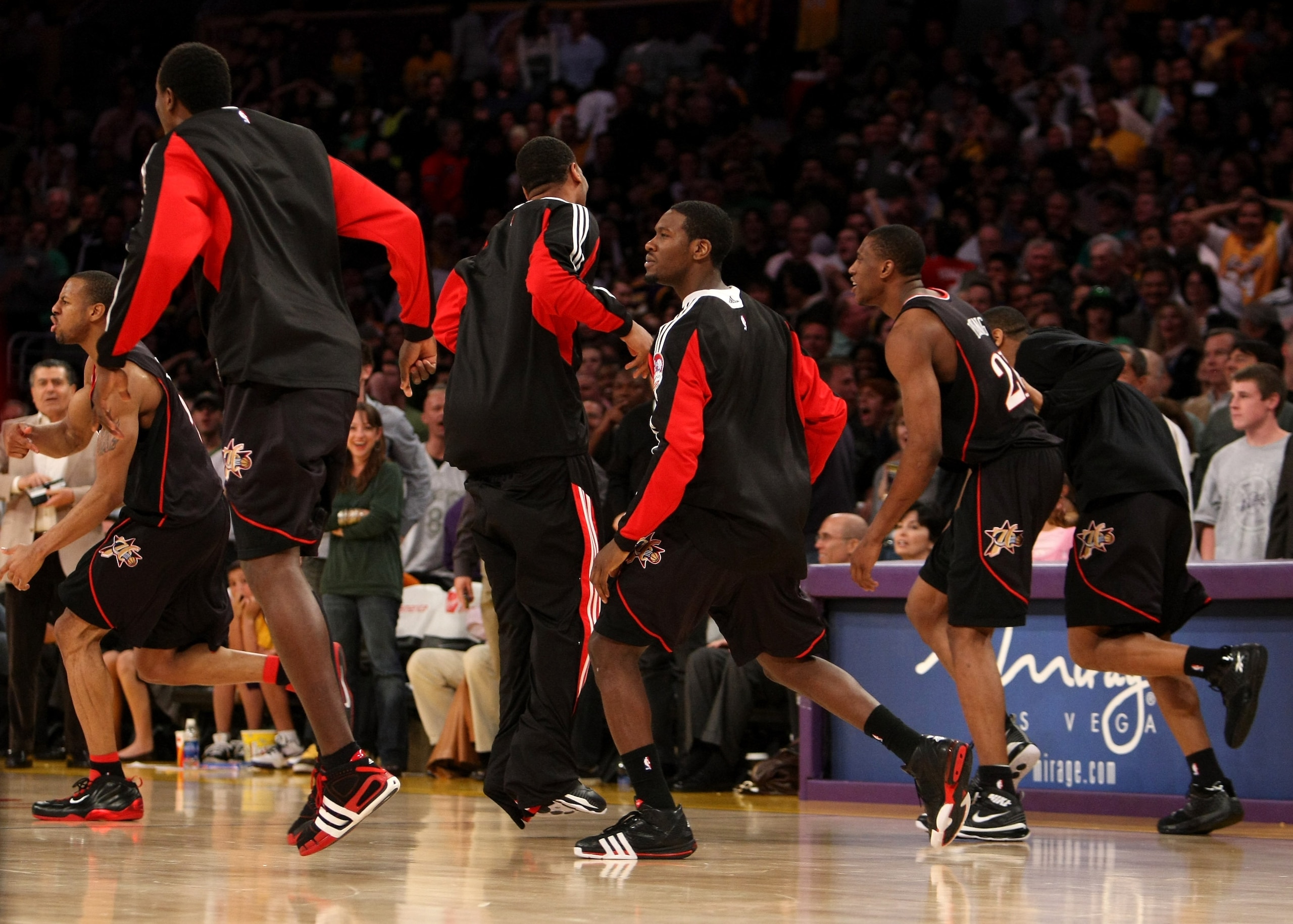 LOS ANGELES, CA - MARCH 17:  Andre Iguodala #9 (L) of the the Philadelphia 76ers celebrates with teammates after making a three point basket at the final buzzer against the Los Angeles Lakers to win the game on March 17, 2009 at Staples Center in Los Ange