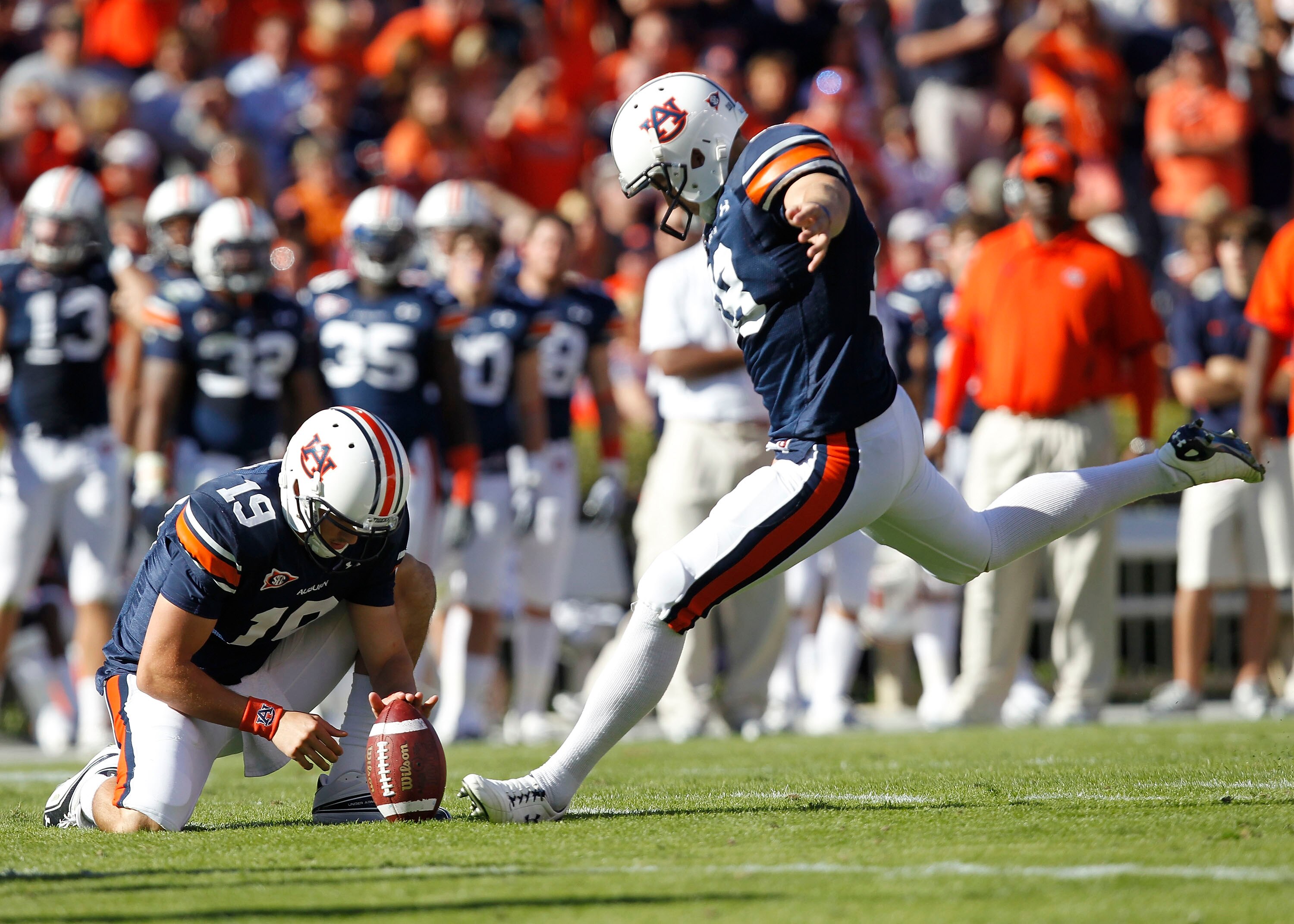 AUBURN - OCTOBER 16:  Field goal kicker Wes Byrum #18 of the Auburn Tigers prepares to kick a field goal in the second quarter while Neil Caudle #19 holds the ball during the game against the Arkansas Razorbacks at Jordan-Hare Stadium on October 16, 2010