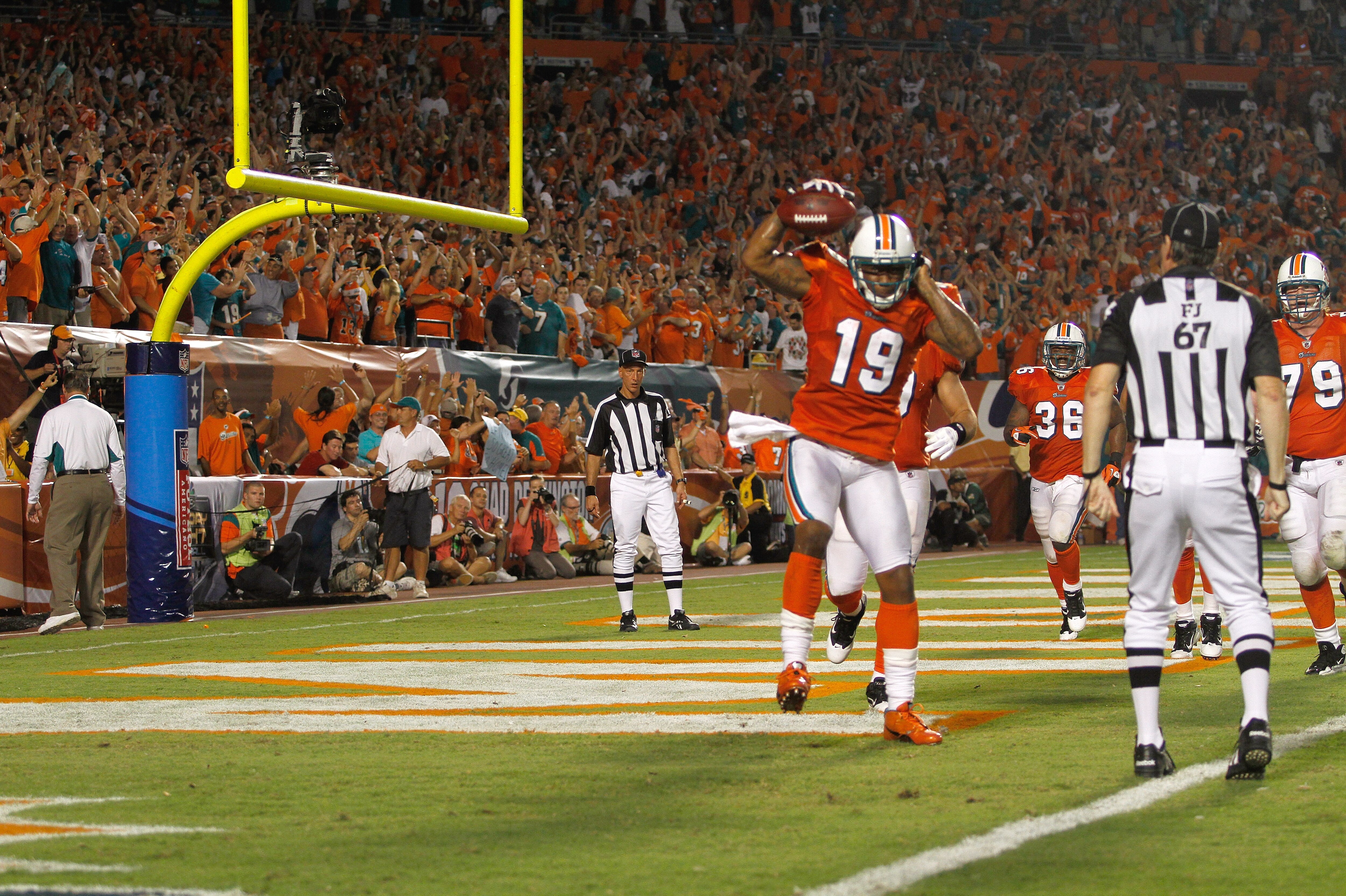 MIAMI - SEPTEMBER 26: ReceiverBrandon Marshall #19 of the Miami Dolphins celebrates a touchdown against the New York Jets at Sun Life Stadium on September 26, 2010 in Miami, Florida. The Jets won 31-23. (Photo by Marc Serota/Getty Images)