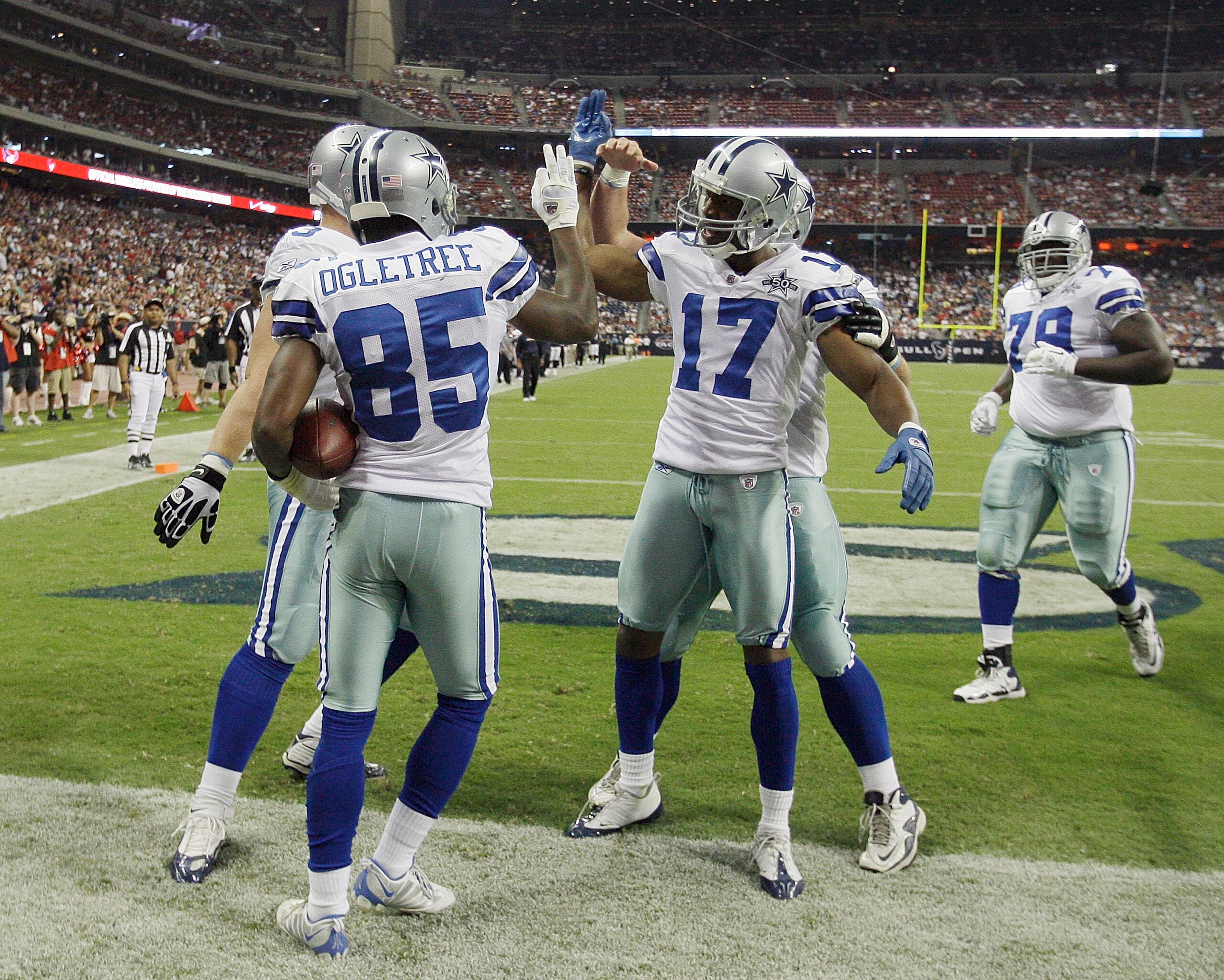 HOUSTON - AUGUST 28:  Wide receiver Kevin Ogletree #85 oif the Dallas Cowboys receives a high five from Sam Hurd #17 after scoring in the fourth quarter against the Houston Texans at Reliant Stadium on August 28, 2010 in Houston, Texas.  (Photo by Bob Lev