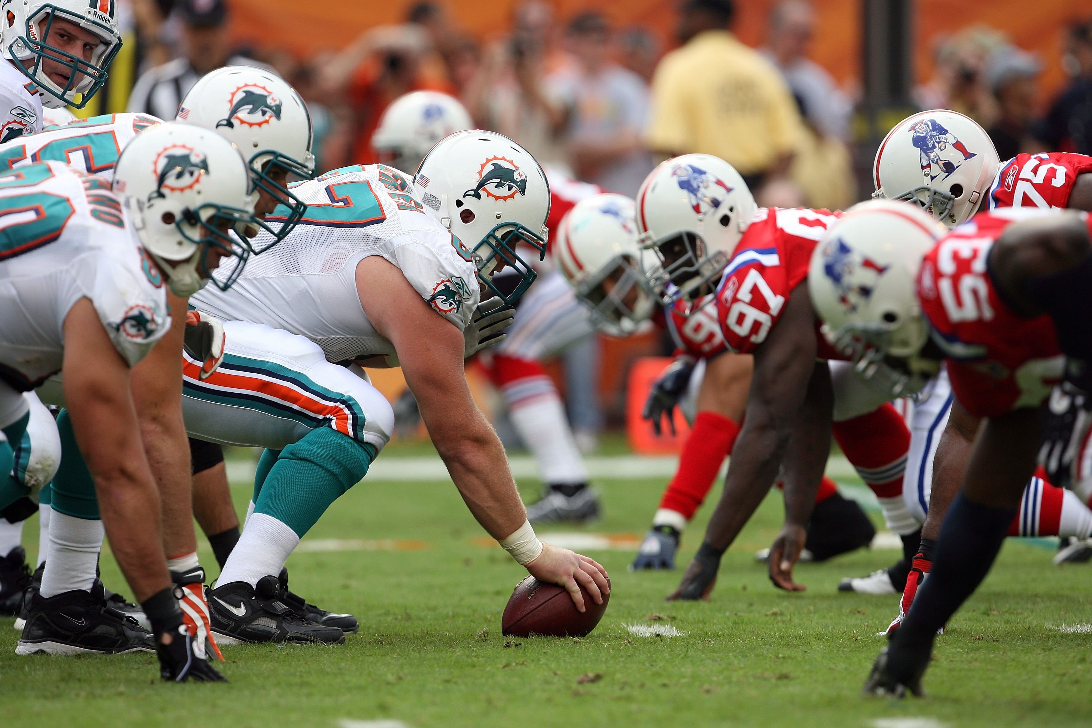 MIAMI - DECEMBER 06:  Quarterback Chad Henne #7 of the Miami Dolphins prepares to take the snap from center Joe Berger #67 while taking on the New England Patriots at Land Shark Stadium on December 6, 2009 in Miami, Florida. The Dolphins defeated the Patr