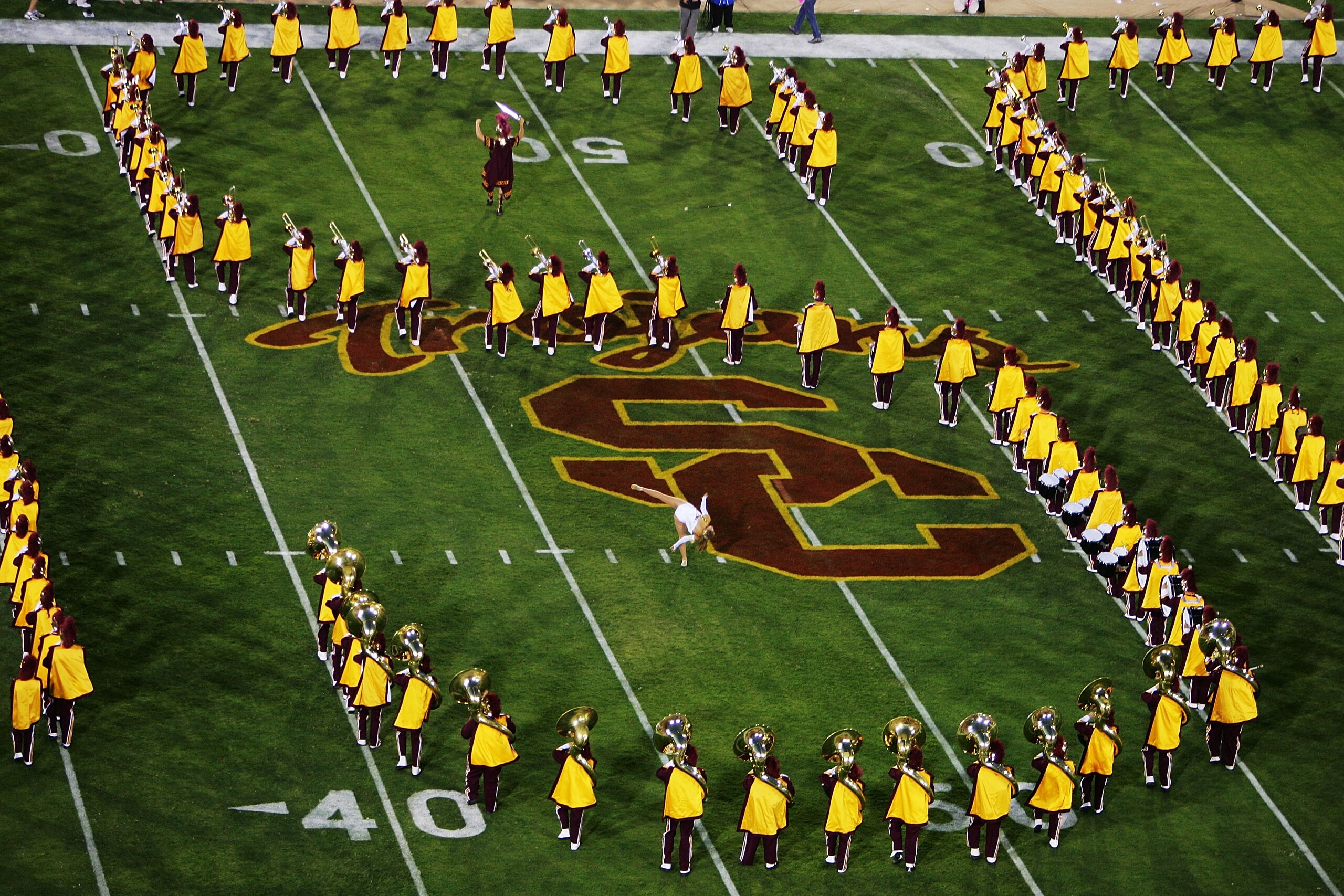 LOS ANGELES - SEPTEMBER 17:  The marching band performs before the NCAA game between the USC Trojans and the Arkansas Razorbacks on September 17, 2005 at the Memorial Coliseum in Los Angeles, California.  (Photo by Donald Miralle/Getty Images)