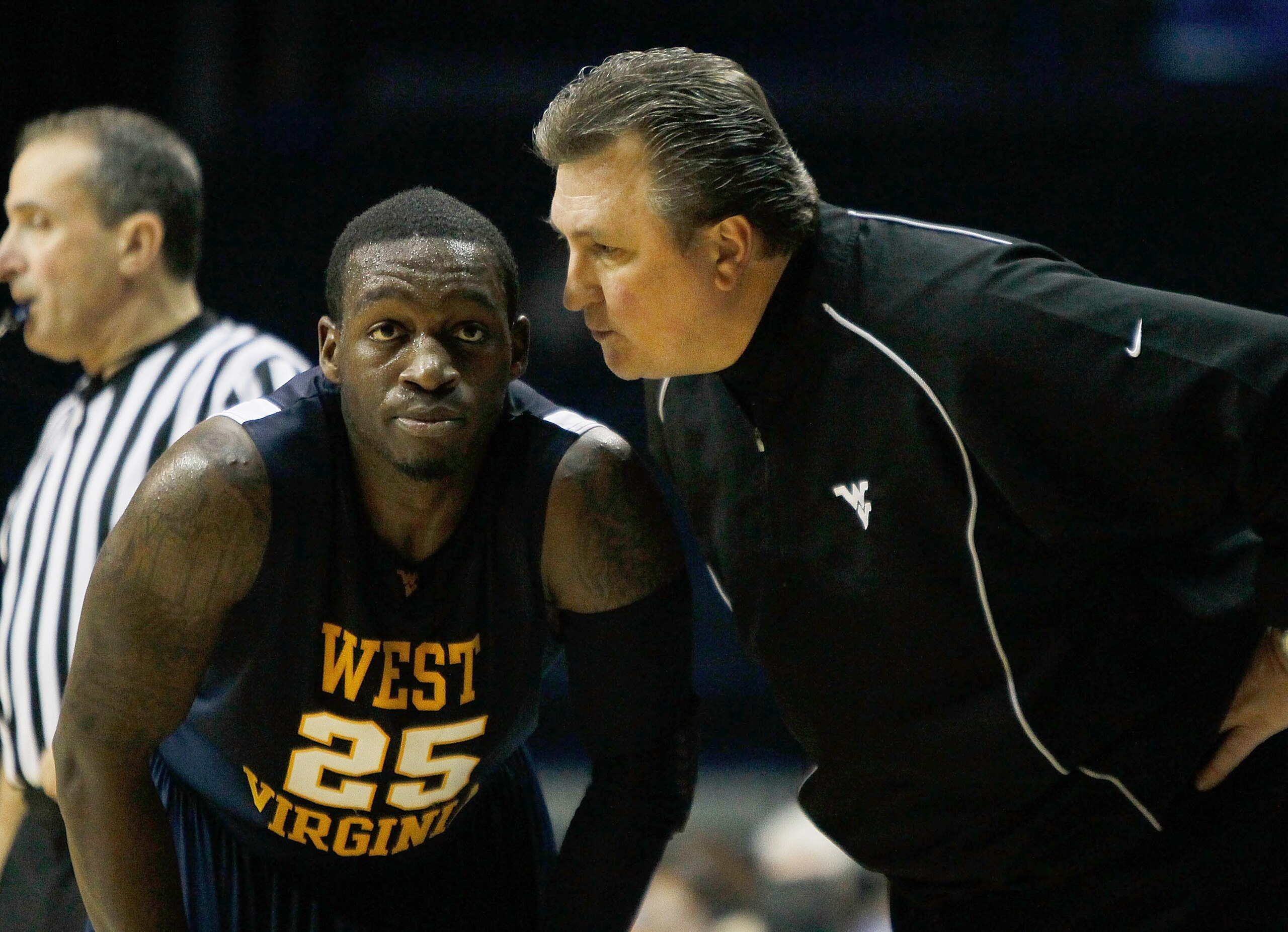 ROSEMONT, IL - JANUARY 26: Head coach Bob Huggins of the West Virginia Mountaineers talks to Darryl Bryant #25 during a game against the DePaul Blue Demons at the Allstate Arena on January 26, 2010 in Rosemont, Illinois. West Virginia defeated DePaul 62-4