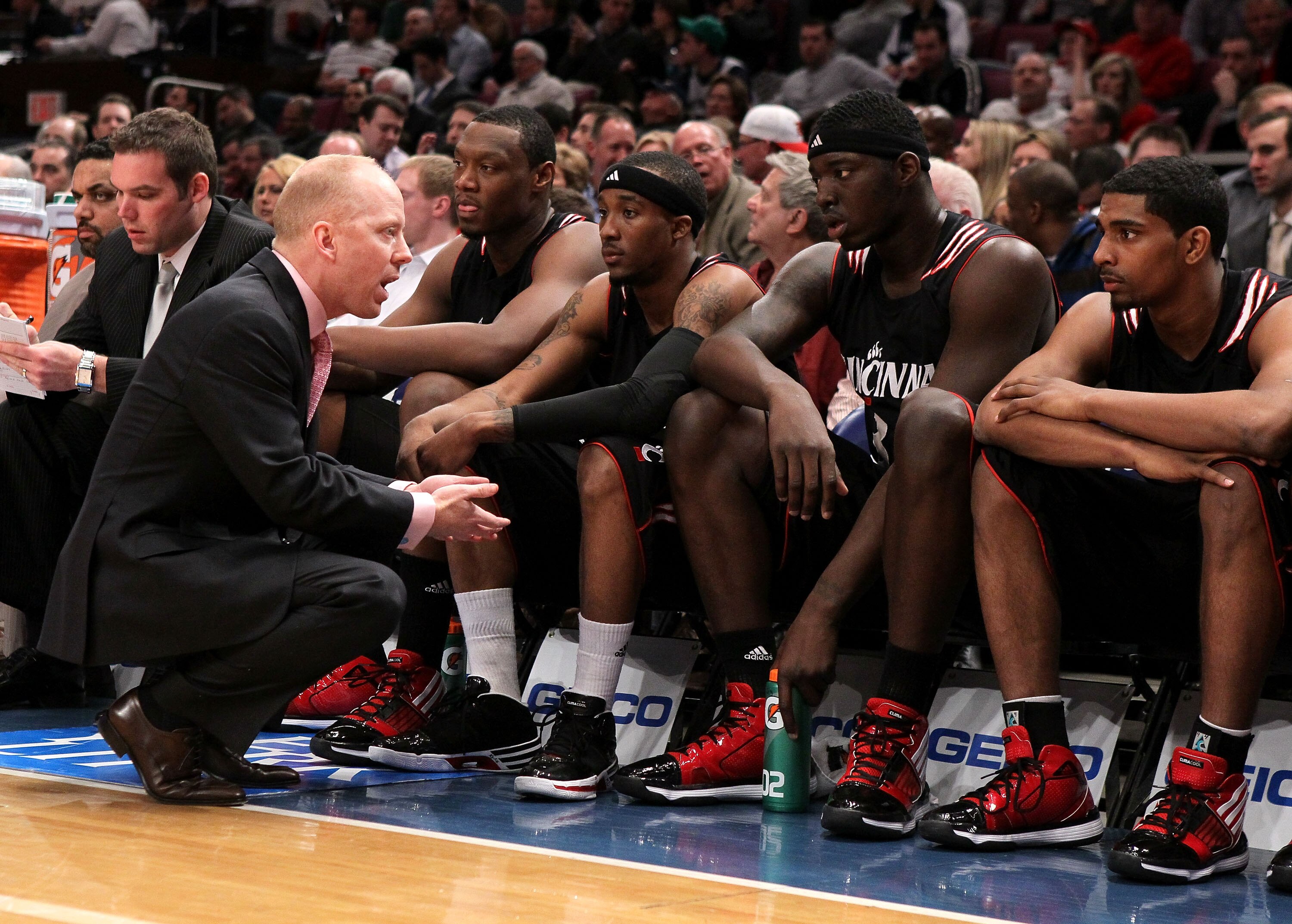 NEW YORK - MARCH 10: Head coach Mick Cronin of the Cincinnati Bearcats talks to his players against the Louisville Cardinals during the second round of 2010 NCAA Big East Tournament at Madison Square Garden on March 10, 2010 in New York City.  (Photo by J