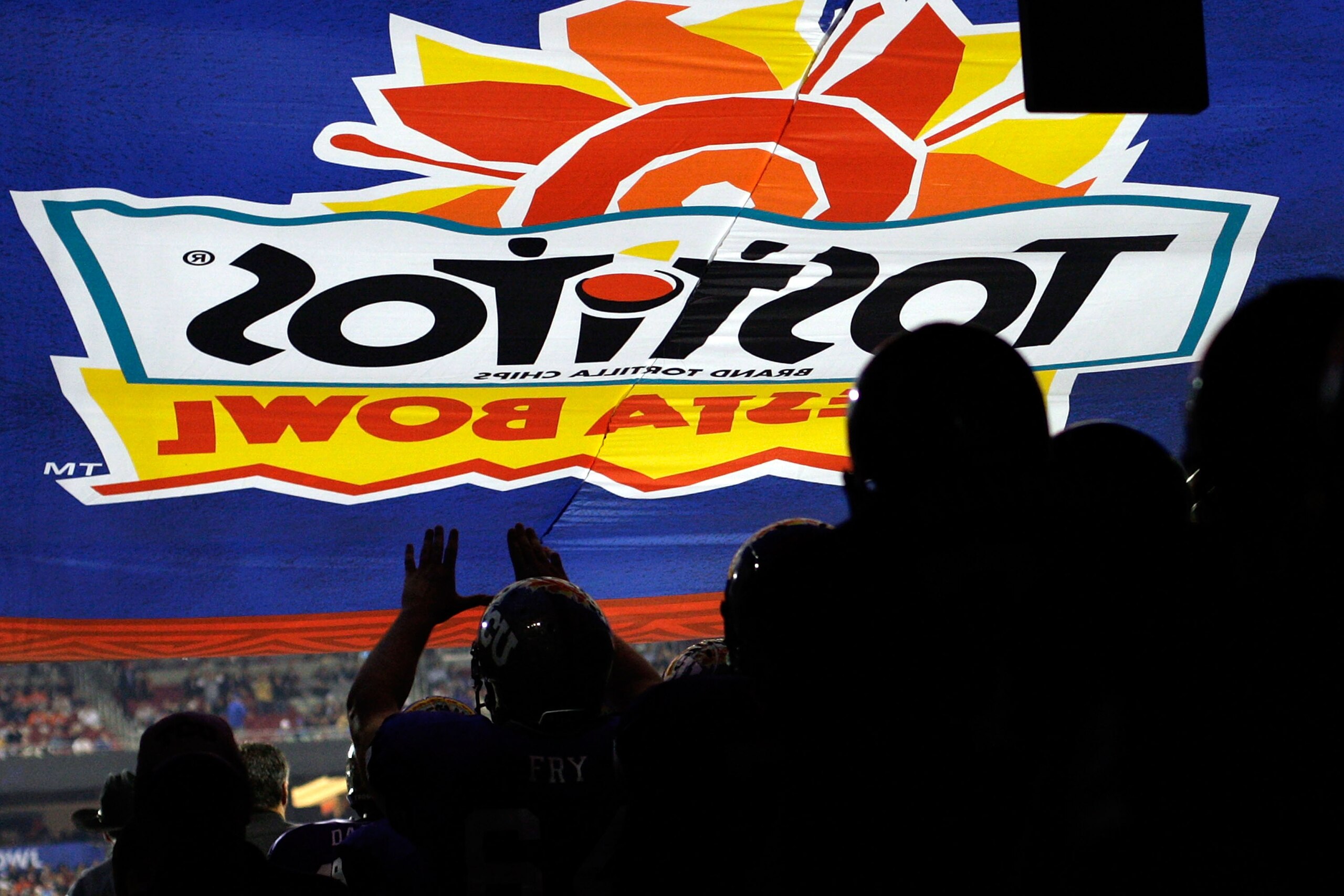 GLENDALE, AZ - JANUARY 04:  The TCU Horned Frogs walk through the tunnel after half time to play the second half against the Boise State Broncos during the Tostitos Fiesta Bowl at the Universtity of Phoenix Stadium on January 4, 2010 in Glendale, Arizona.