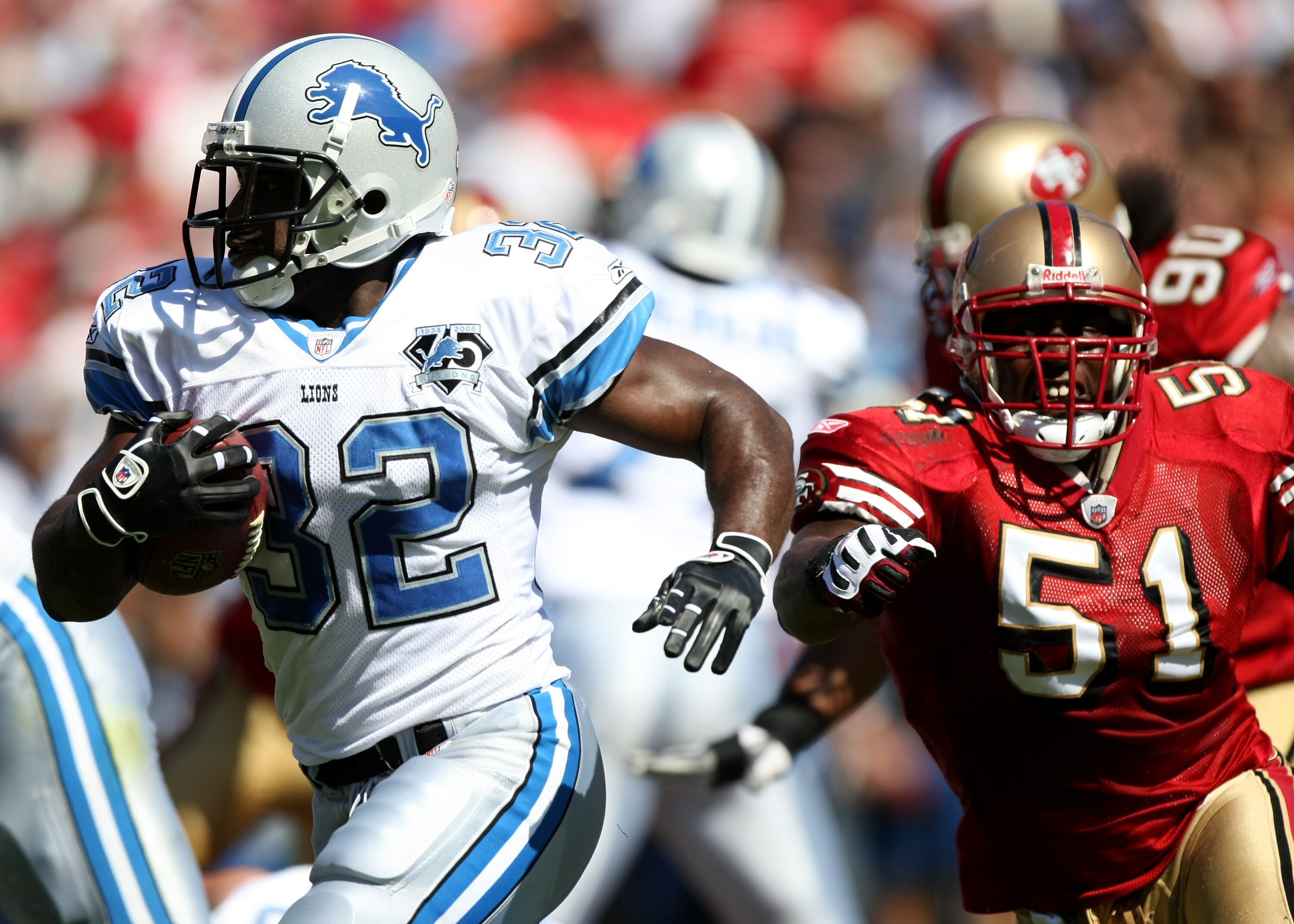 SAN FRANCISCO - SEPTEMBER 21: Rudi Johnson #32 of the Detroit Lions runs against Takeo Spikes #51 of the San Francisco 49ers during an NFL game on September 21, 2008 at Candlestick Park in San Francisco, California.  (Photo by Jed Jacobsohn/Getty Images)