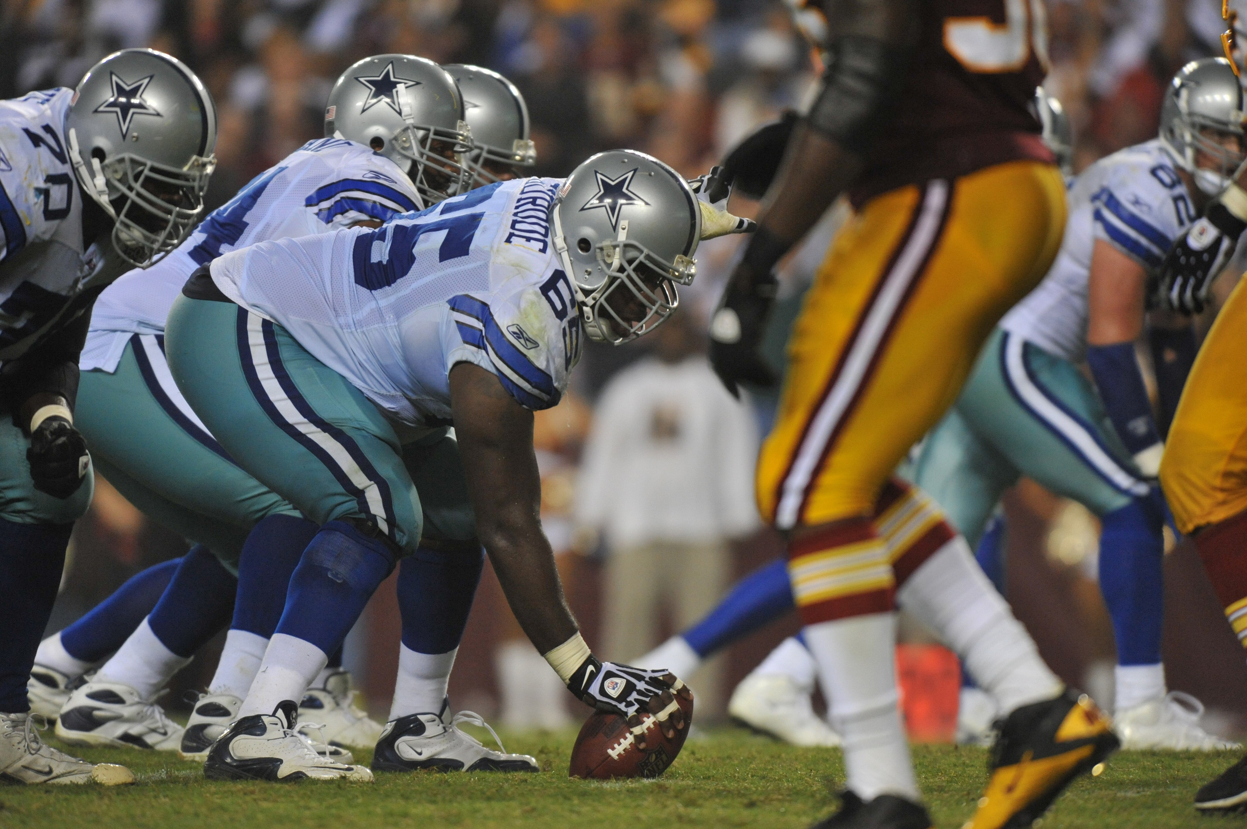 LANDOVER - SEPTEMBER 12:  Andre Gurode #65 of the Dallas Cowboys prepares to snap the ball during the NFL season opener against the Washington Redskins at FedExField on September 12, 2010 in Landover, Maryland. The Redskins defeated the Cowboys 13-7. (Pho