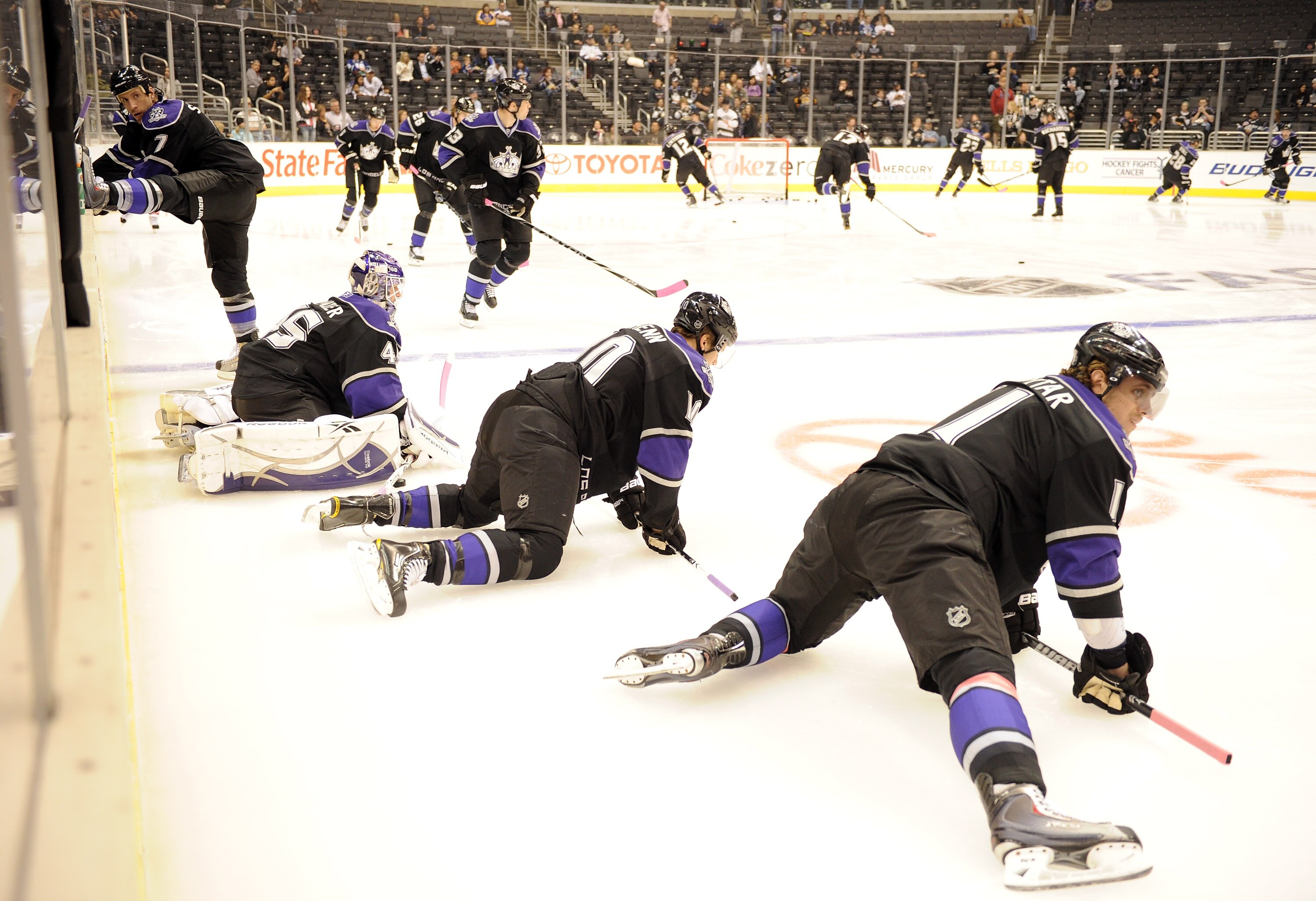 LOS ANGELES, CA - OCTOBER 15:  Anze Kopitar #11, Brayden Schenn #10, Jonathan Bernier #45 and Rob Scuderi #7 of the of the Los Angeles Kings stretch during warm up against the Vancouver Canucks at the Staples Center on October 15, 2010 in Los Angeles, Cal