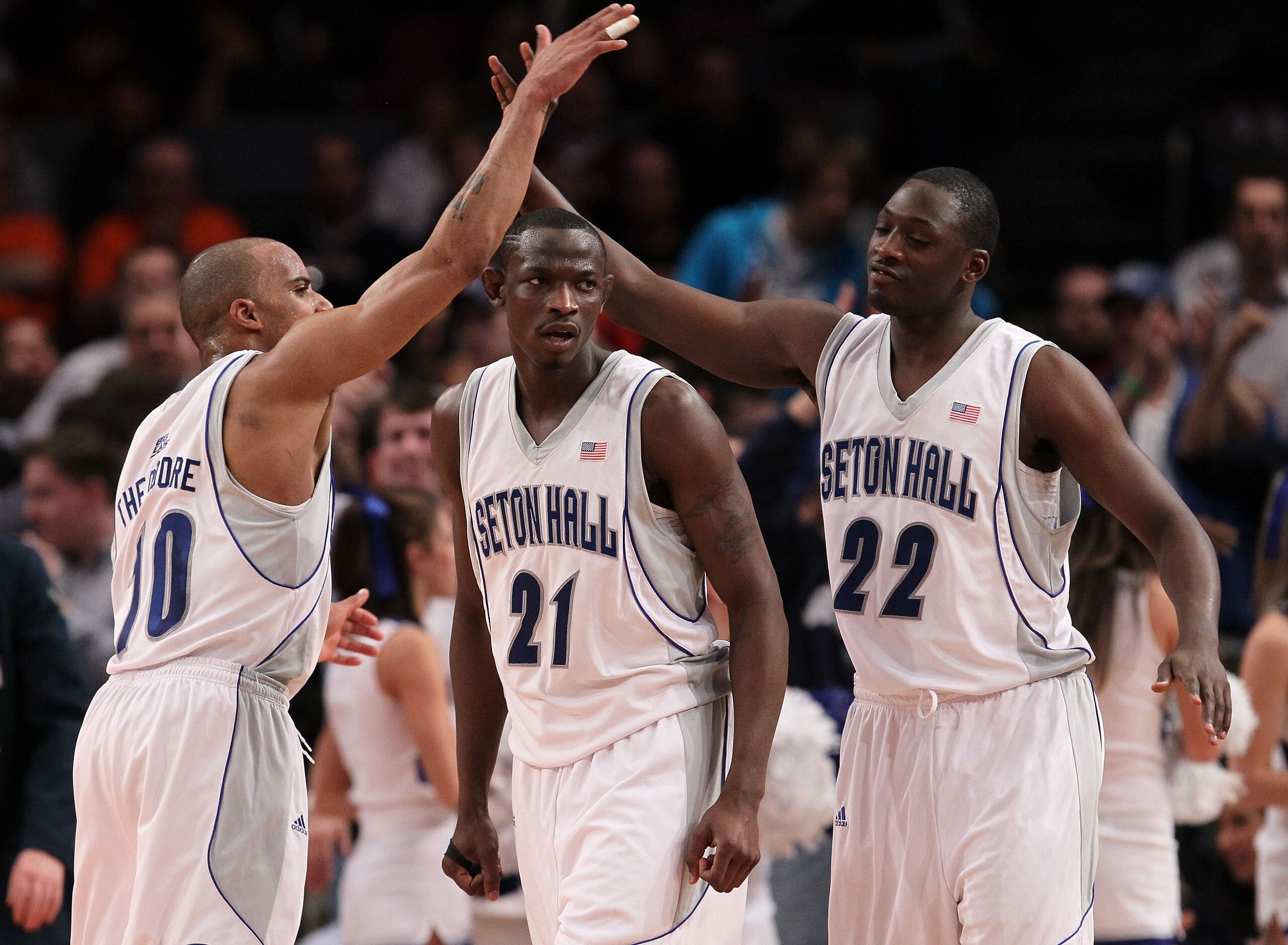NEW YORK - MARCH 09: Jordan Theodore #10, Jeremy Hazell #21 and Jamel Jackson #22 of the Seton Hall Pirates celebrate after a play against the Providence Friars during the first round game of the Big East Basketball Tournament at Madison Square Garden on