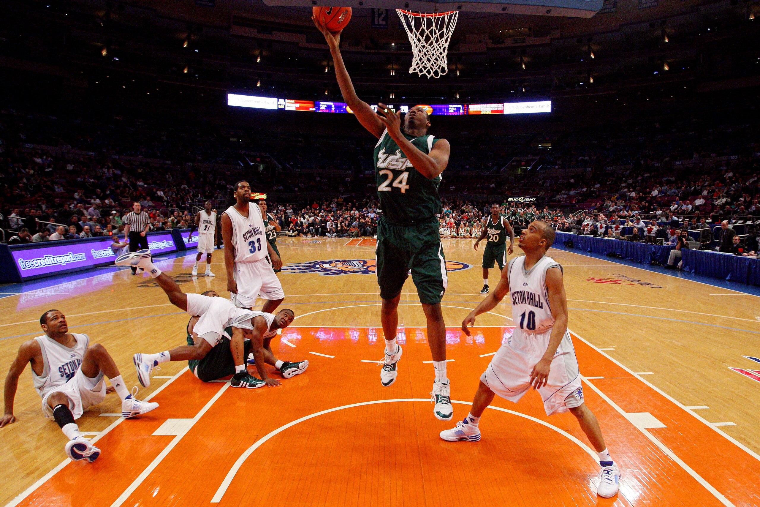 NEW YORK - MARCH 10:  Augustus Gilchrist #24 of the USF Bulls goes to the hoop against Jordan Theodore #10 of the Seton Hall Pirates during the first round of the Big East Tournament at Madison Square Garden on March 10, 2009 in New York City.  (Photo by