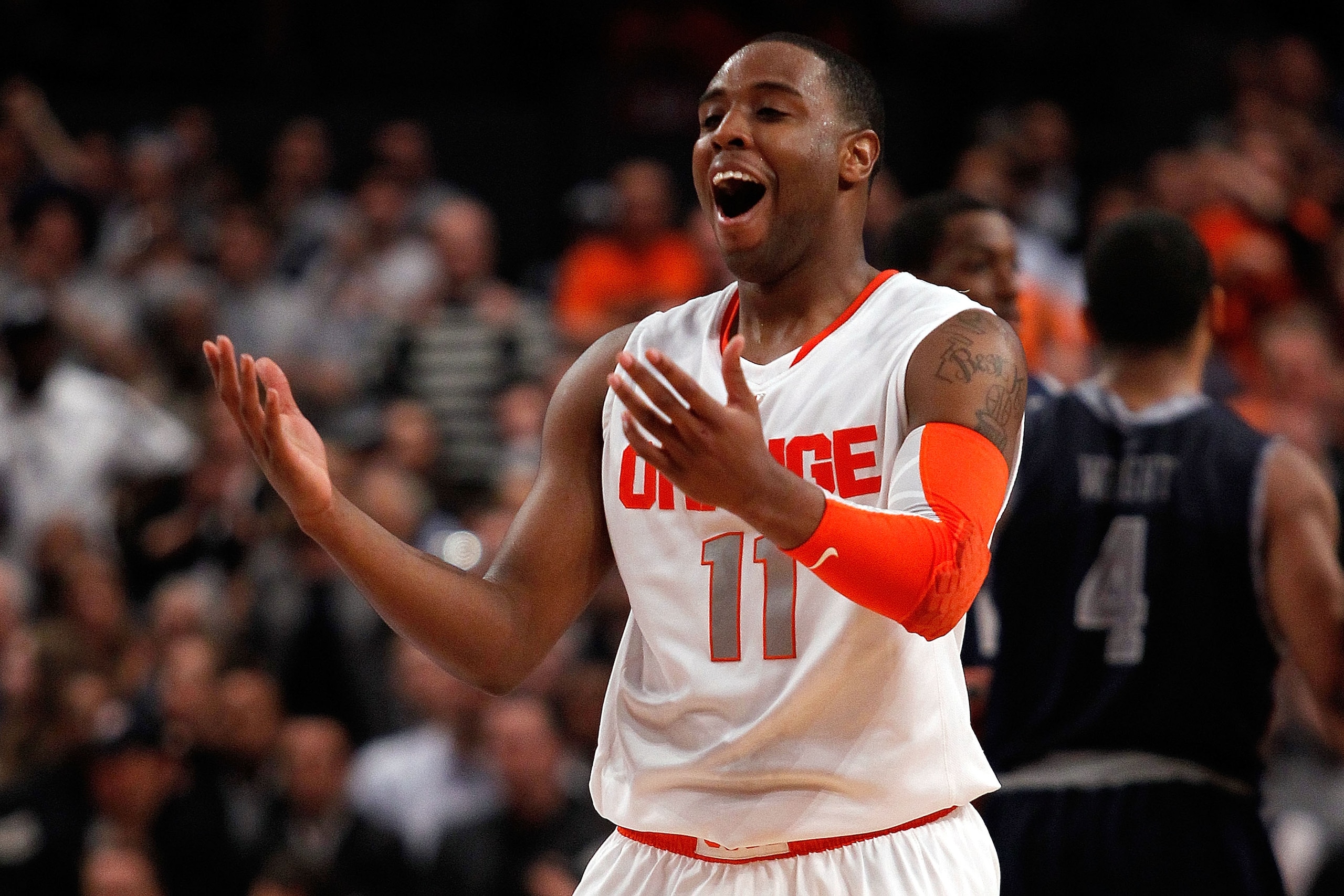 NEW YORK - MARCH 11:  Scoop Jardine #11 of the Syracuse Orange reacts after a call against the Georgetown Hoyas during the quarterfinal of the 2010 NCAA Big East Tournament at Madison Square Garden on March 11, 2010 in New York City.  (Photo by Michael He
