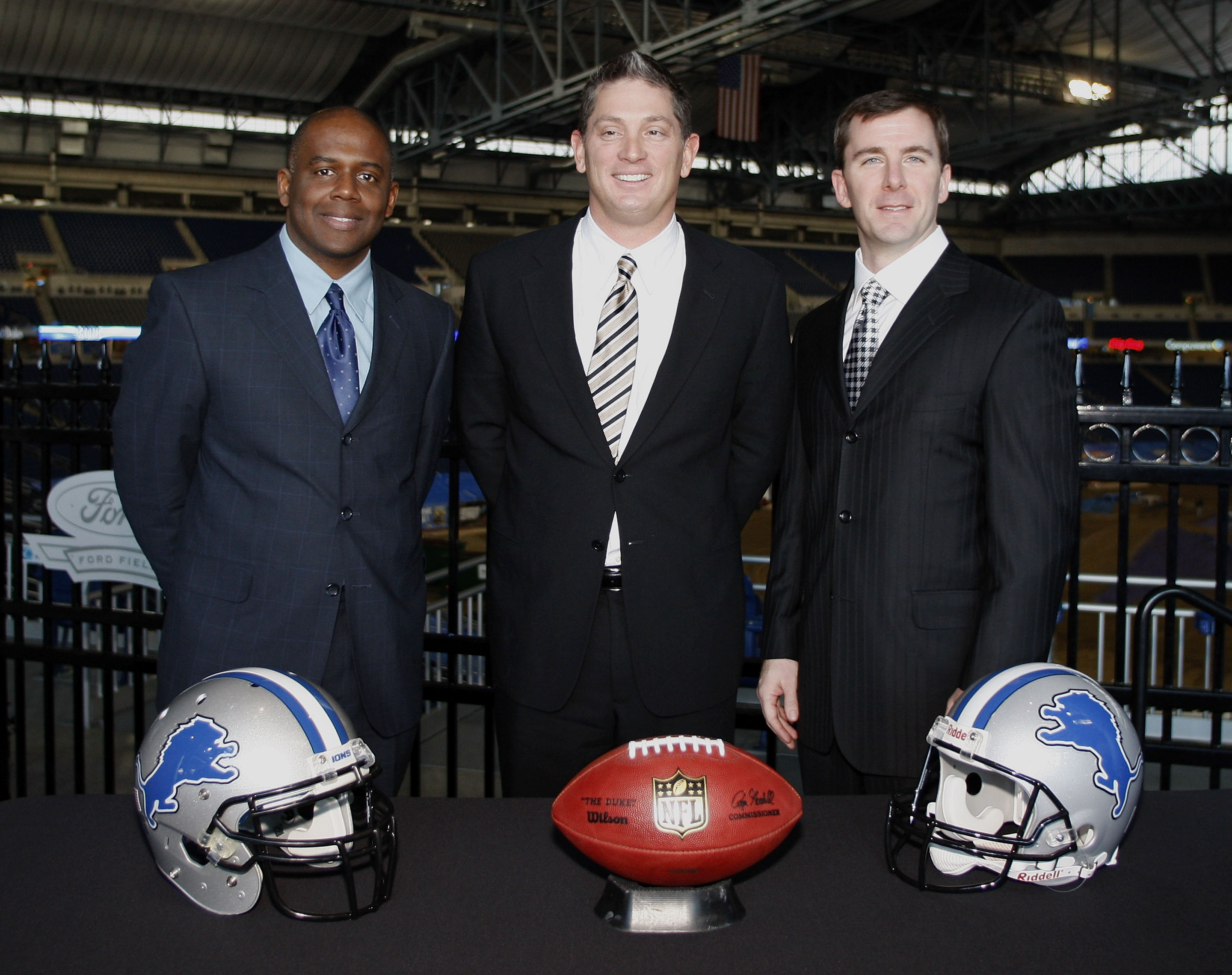 DETROIT , MI - JANUARY 16:  Jim Schwartz, center, head coach of the Detroit Lions poses with General Manager Martin Mayhew, left, and Tom Lewand team president after a press conference to introduce him as the Lions new head coach on January 16, 2009 at Fo