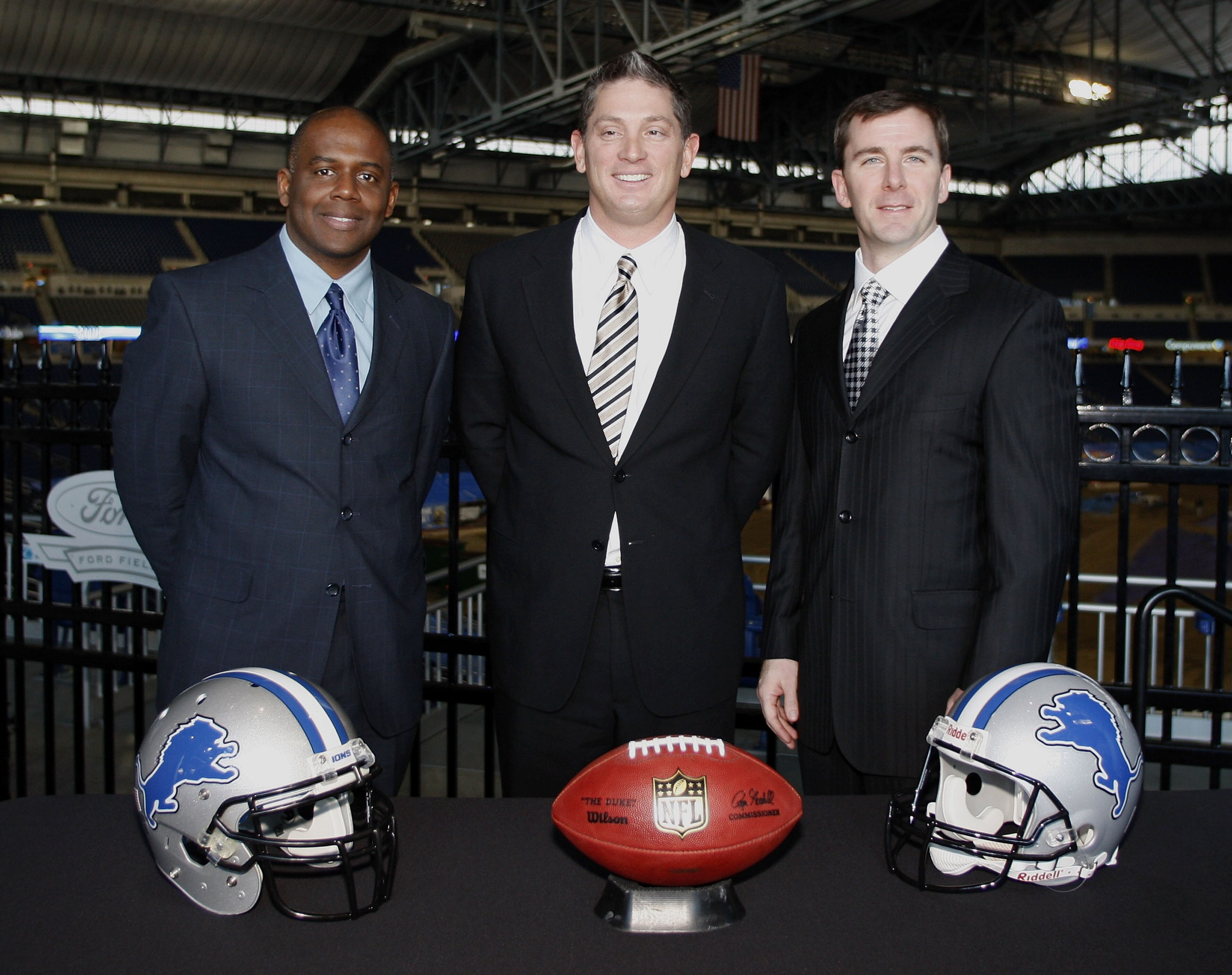 DETROIT , MI - JANUARY 16:  Jim Schwartz, center, head coach of the Detroit Lions poses with General Manager Martin Mayhew, left, and Tom Lewand team president after a press conference to introduce him as the Lions new head coach on January 16, 2009 at Fo