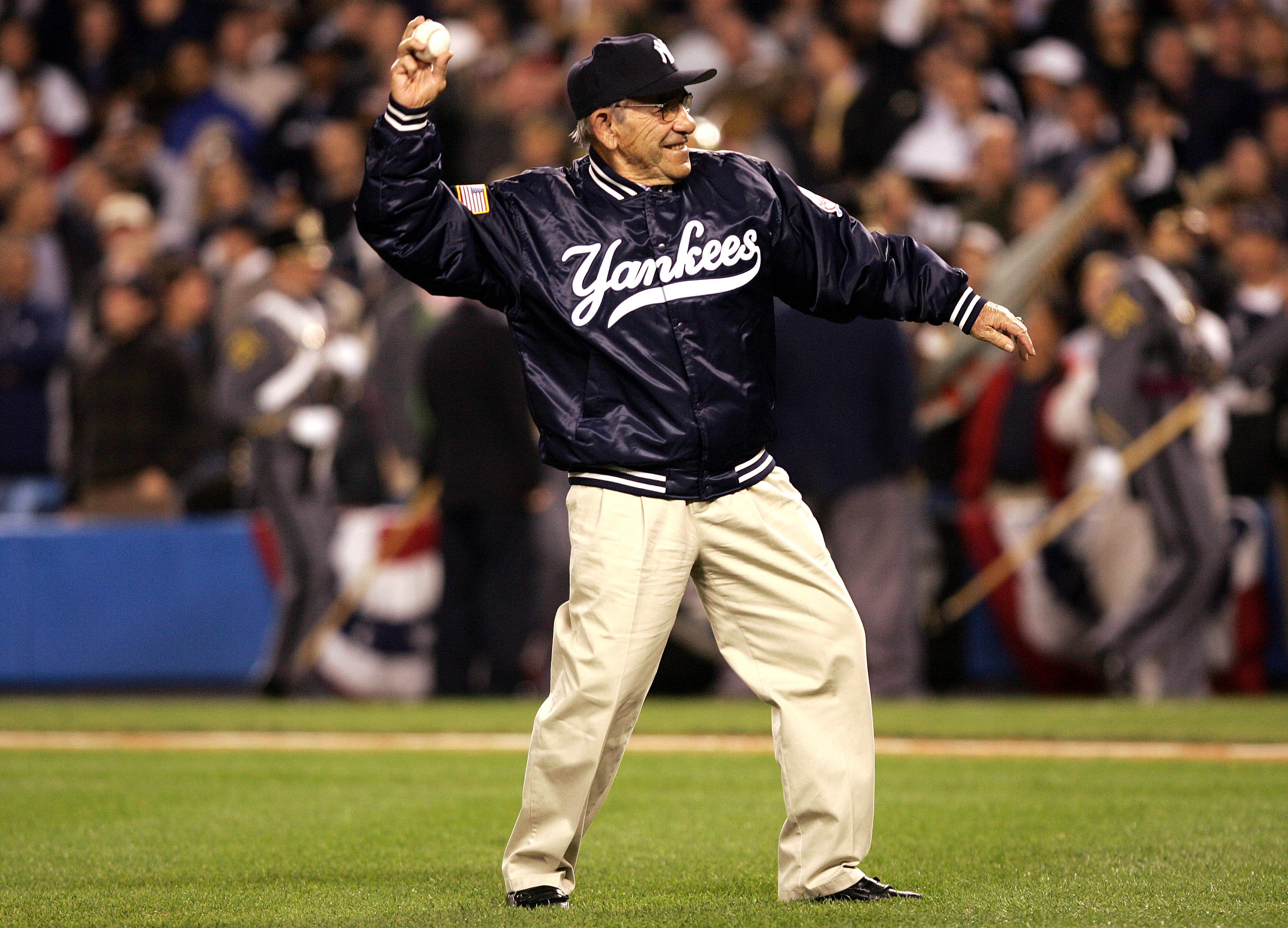 NEW YORK - OCTOBER 12:  New York Yankees Hall of Fame catcher Yogi Berra throws out the ceremonial first pitch during game one of the American League Championship Series on October 12, 2004 at Yankee Stadium in the Bronx borough of New York City. (Photo b