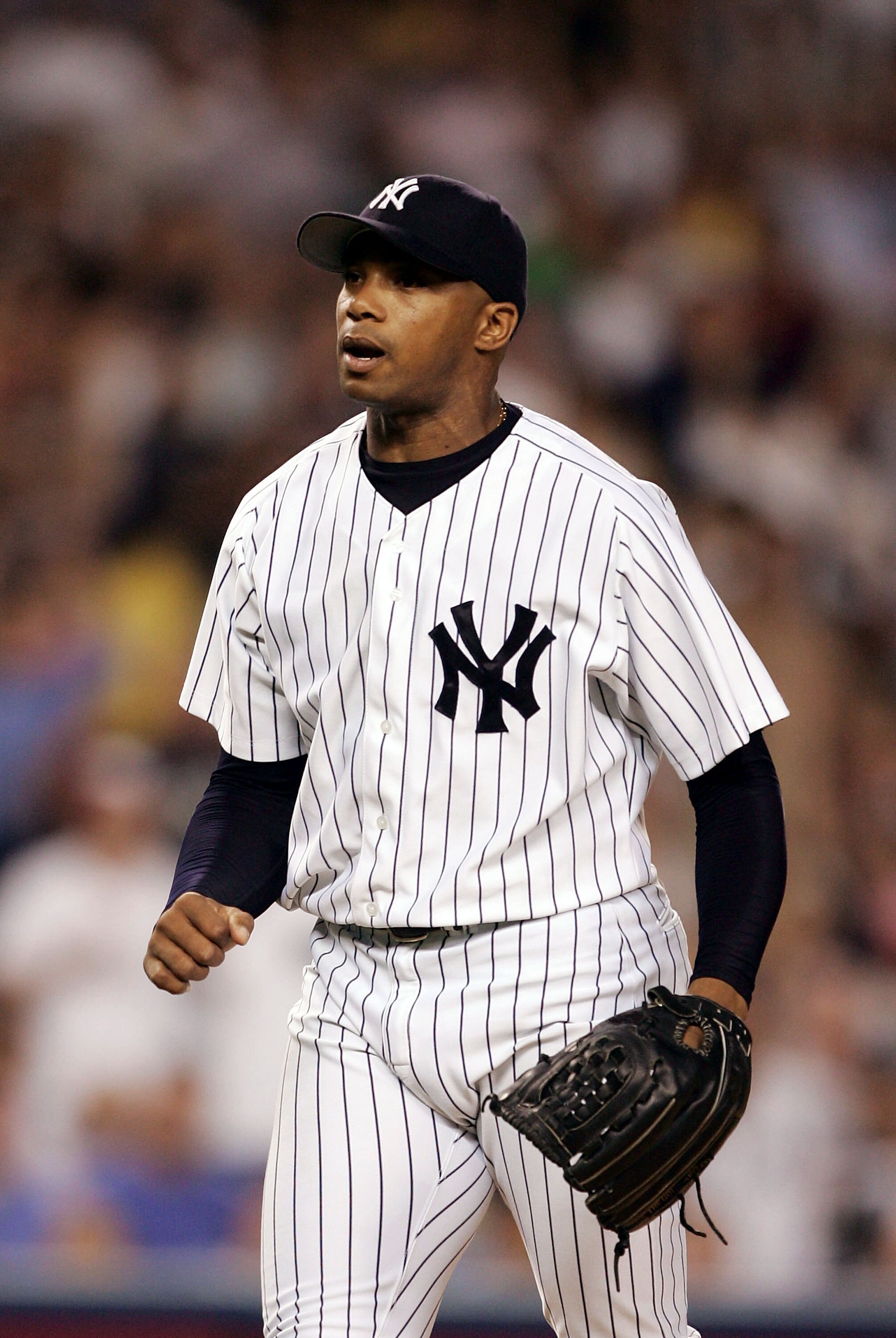 NEW YORK - SEPTEMBER 22:  Orlando Hernandez #26 of the New York Yankees reacts after striking out the side with bases loaded in the third inning against the Toronto Blue Jays September 22, 2004 at Yankee Stadium in the Bronx, New York.  (Photo by Al Bello