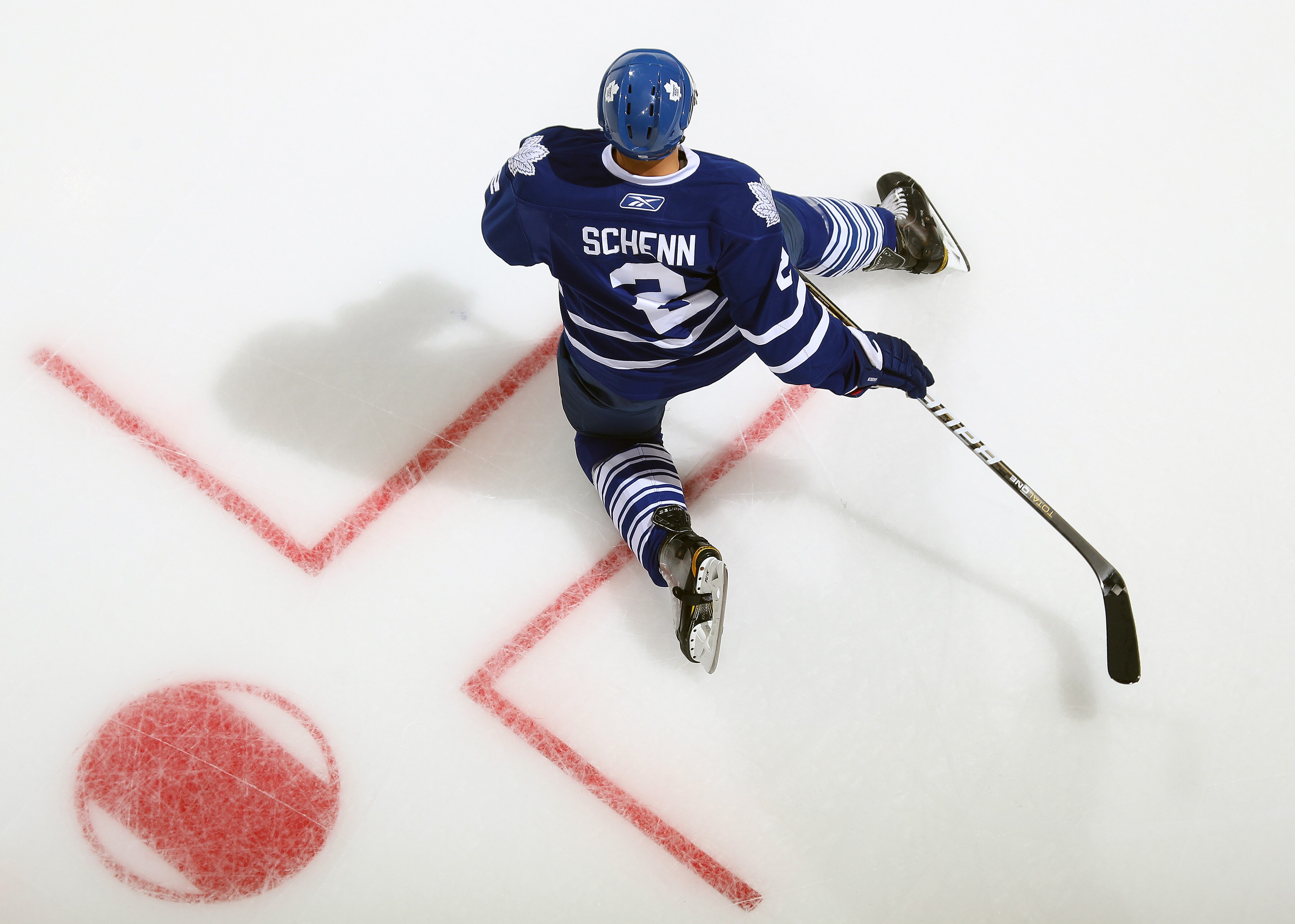 LONDON,ON - SEPTEMBER 23: Luke Schenn #2 of the Toronto Maple Leafs stretches in the warm-up prior to a pre-season game against the Philadelphia Flyers on September 23,2010 at the John Labatt Centre in London, Ontario. The Leafs defeated the Flyers 3-2 in