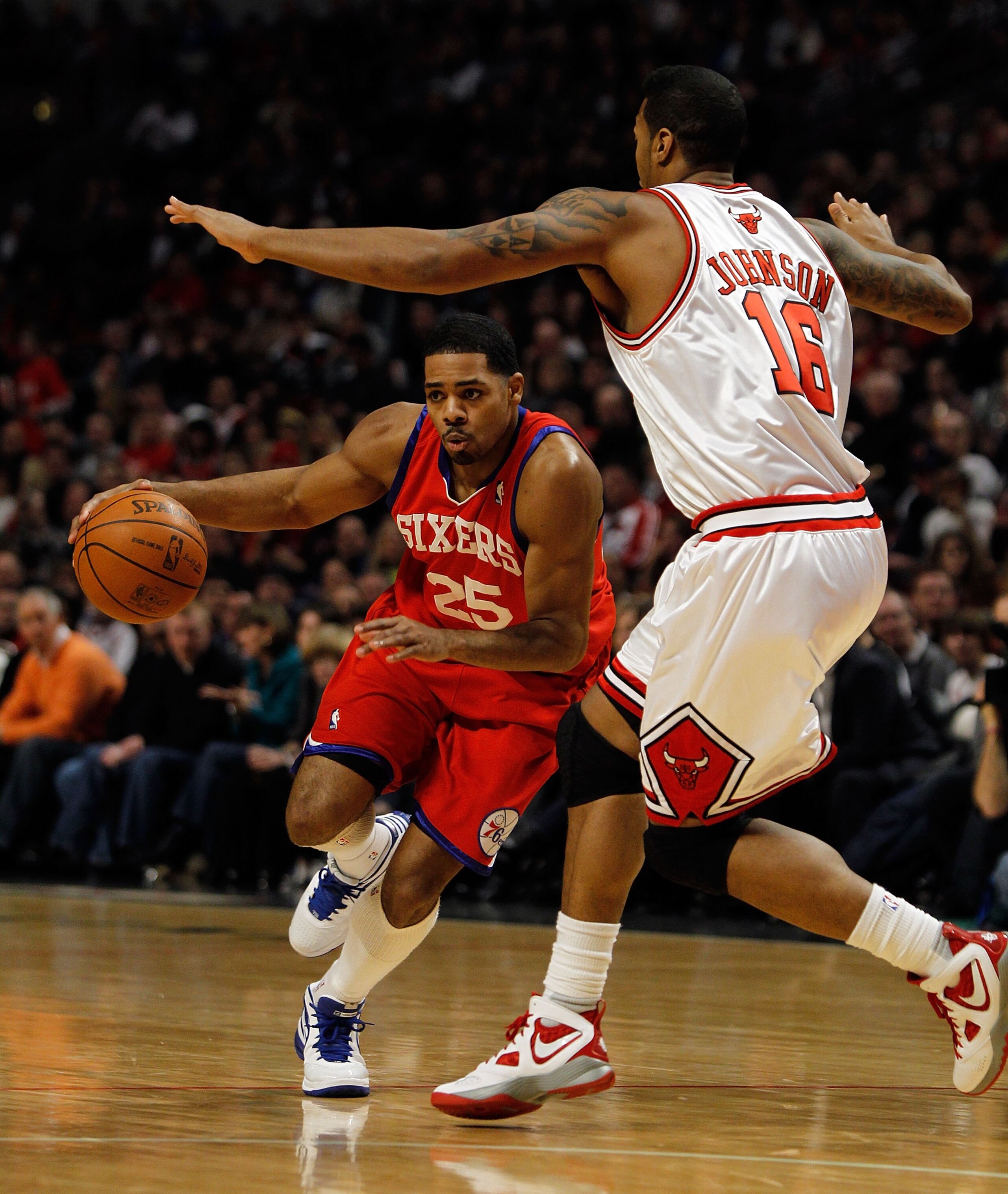 CHICAGO - FEBRUARY 20: Rodney Carney #25 of the Philadelphia 76ers moves against James Johnson #16 of the Chicago Bulls at the United Center on February 20, 2010 in Chicago, Illinois. The Bulls defeated the 76ers 122-90. NOTE TO USER: User expressly ackno