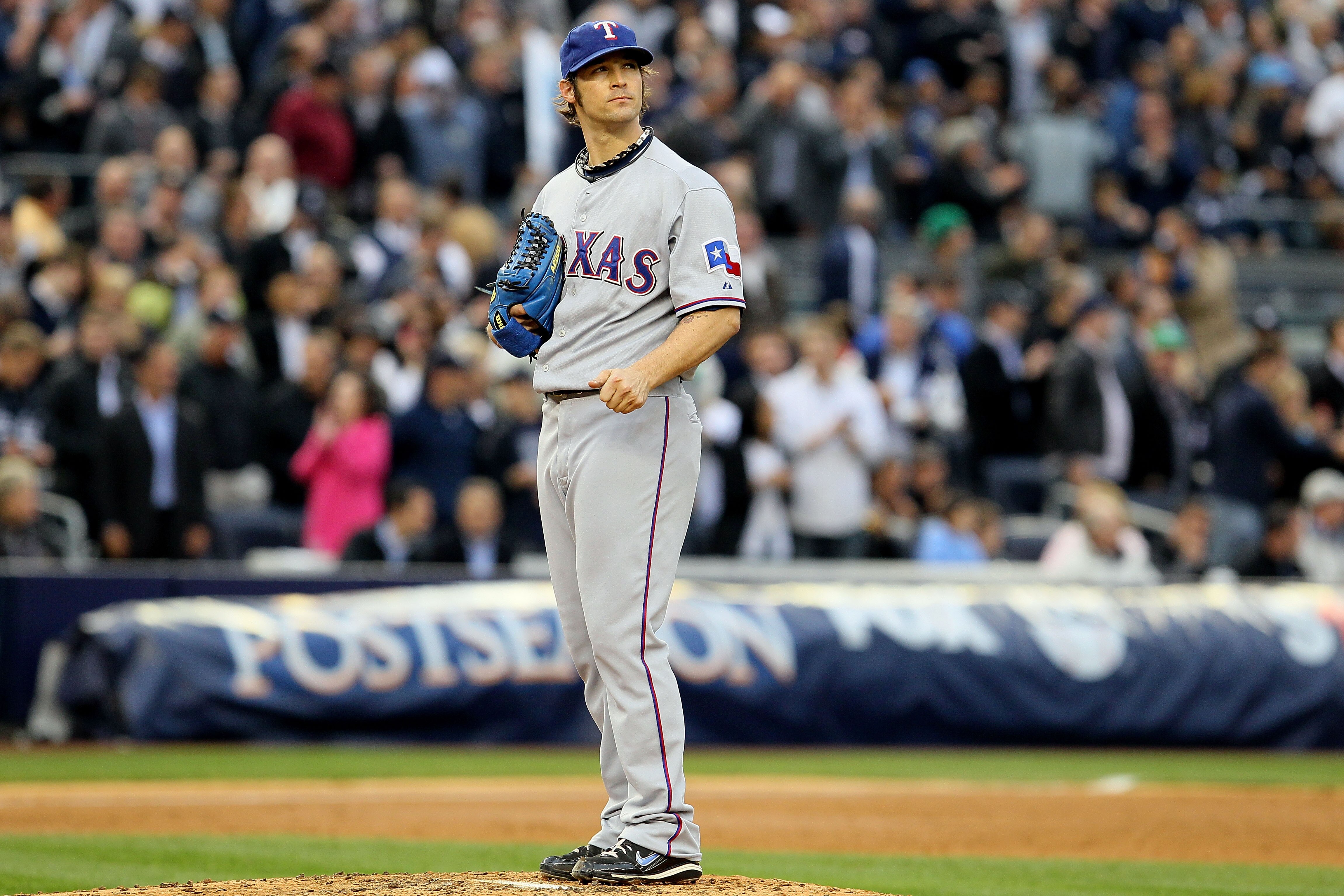 NEW YORK - OCTOBER 20:  Starting pitcher C.J. Wilson #36 of the Texas Rangers looks on against the New York Yankees in Game Five of the ALCS during the 2010 MLB Playoffs at Yankee Stadium on October 20, 2010 in the Bronx borough of New York City.  (Photo