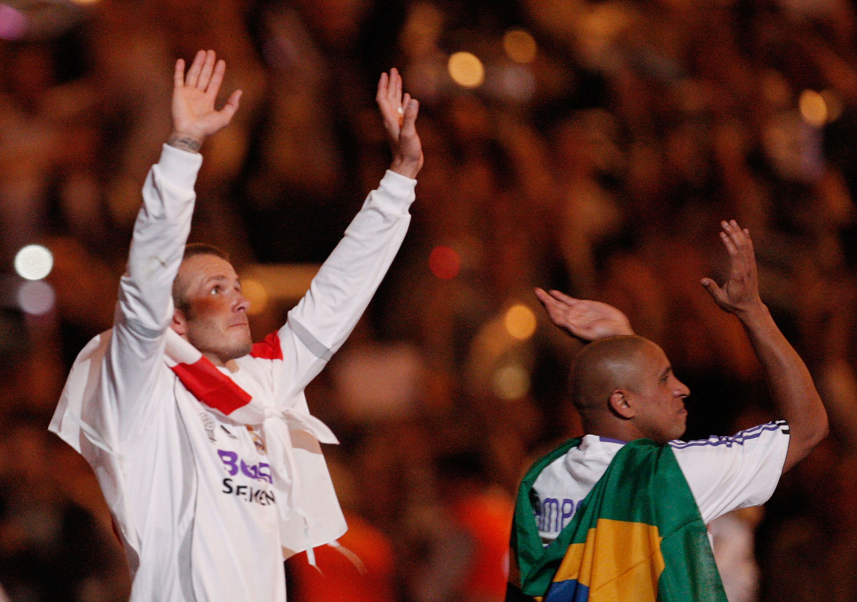 MADRID, SPAIN - JUNE 17:  David Beckham (L) of Real Madrid celebrates with Roberto Carlos after Real won the Primera Liga after the Primera Liga match between Real Madrid and Mallorca at the Santiago Bernabeu stadium on June 17, 2007 in Madrid, Spain.  (P