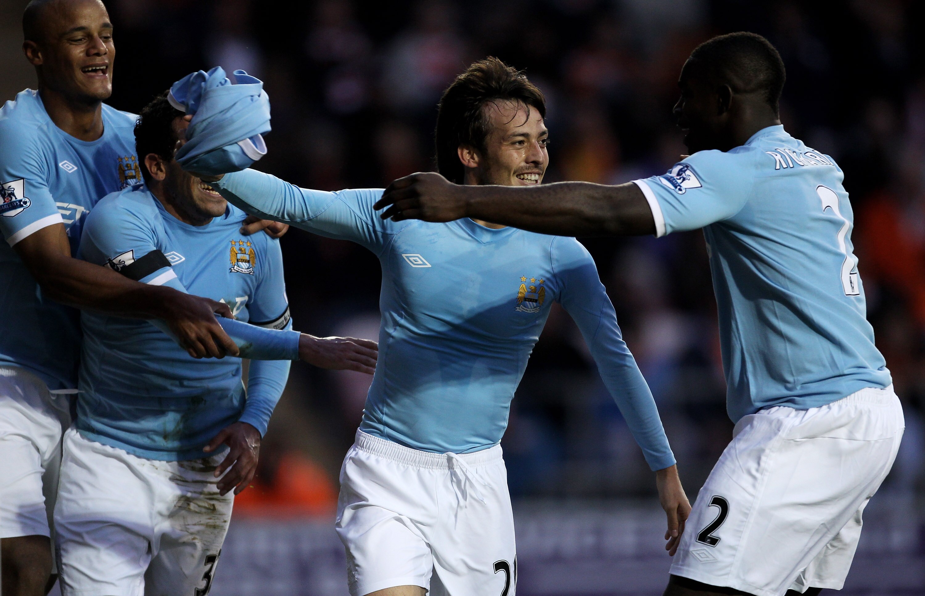 BLACKPOOL, ENGLAND - OCTOBER 17:  David Silva of Manchester City celebrates with his team mates after scoring his team's third goal during the Barclays Premiership match between Blackpool and Manchester City at Bloomfield Road on October 17, 2010 in Black