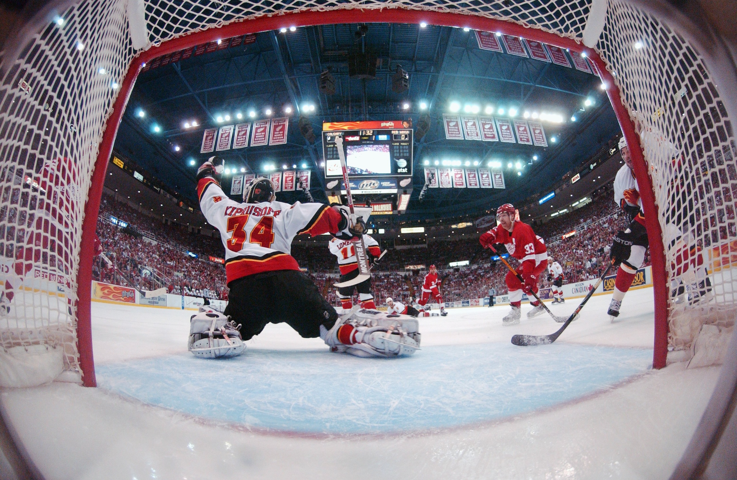 DETROIT - APRIL 21:  Goaltender Miikka Kiprusoff #34 of the Calgary Flames makes a glove save against the Detroit Red Wings in game 5 of the Western Conference Quarterfinals during the 2007 NHL Stanley Cup Playoffs at Joe Louis Arena April 21, 2007 in Det