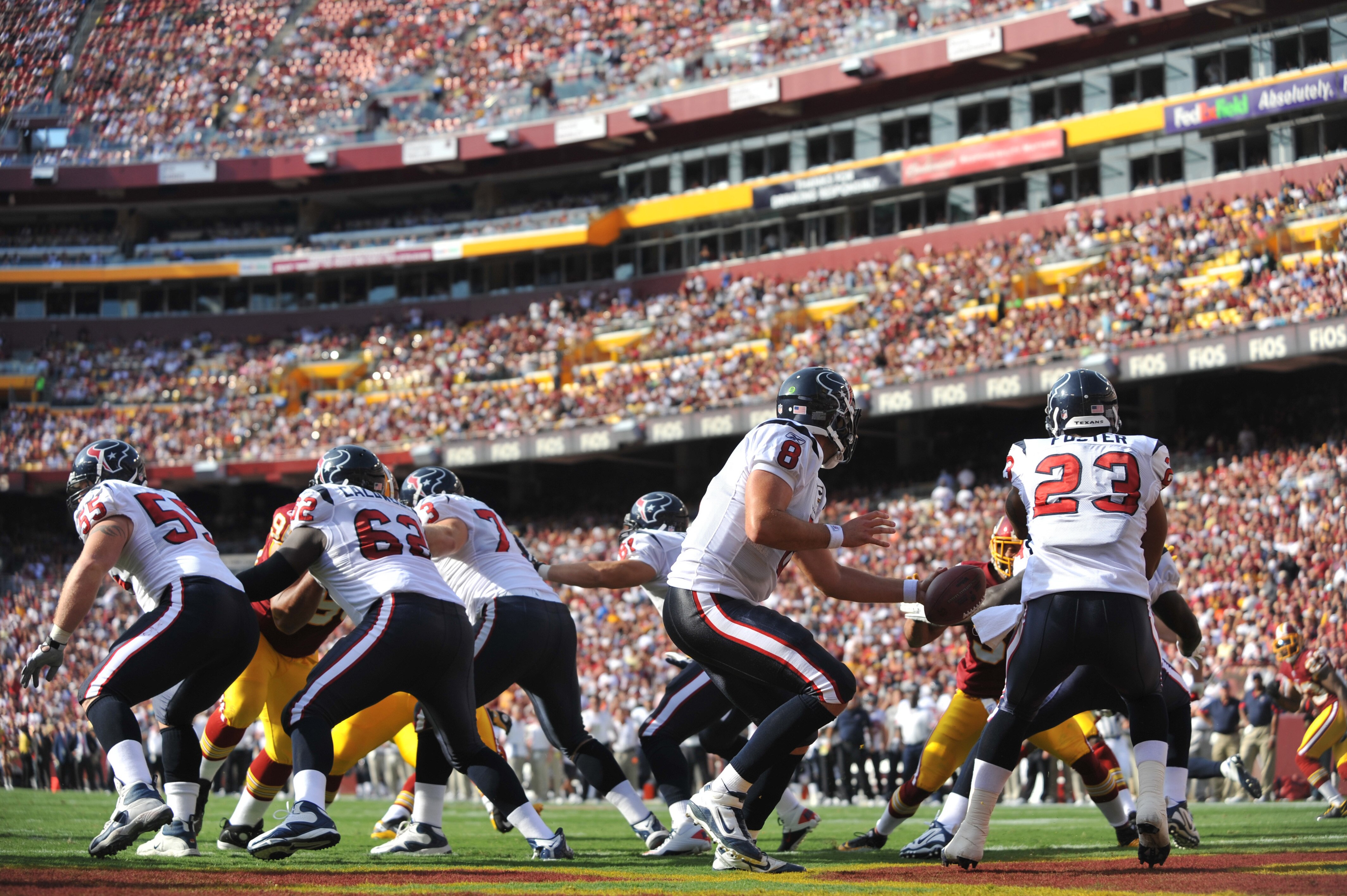LANDOVER - SEPTEMBER 19:  Matt Schaub #8 of the Houston Texans hands off to Arian Foster #23 of the Houston Texans during the game against the Washington Redskins at FedExField on September 19, 2010 in Landover, Maryland. The Texans defeated the Redskins