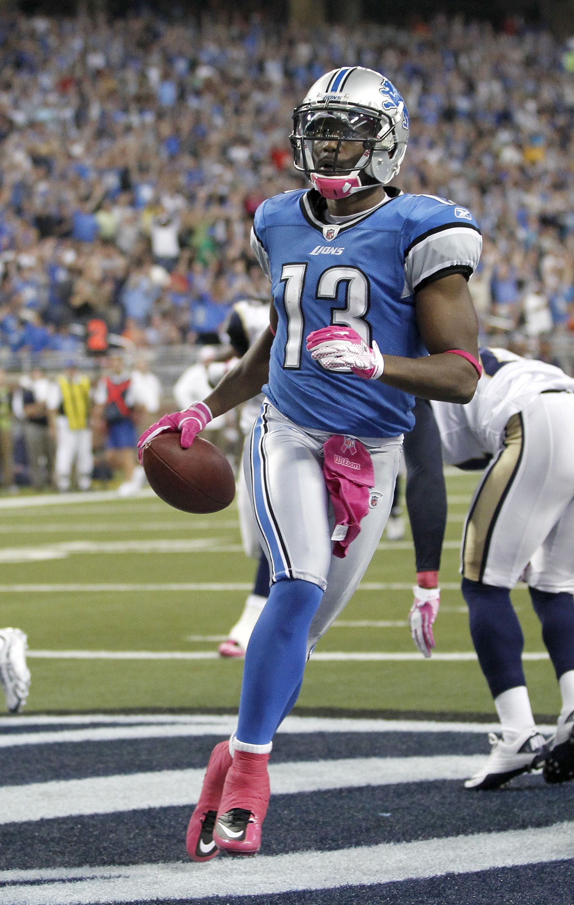 DETROIT - OCTOBER 10: Nate Burleson #13 of the Detroit Lions celebrates a third quarter touchdown against the St. Louis Rams on October 10, 2010 at Ford Field in Detroit, Michigan. Detroit won the game 44-6. (Photo by Gregory Shamus/Getty Images)