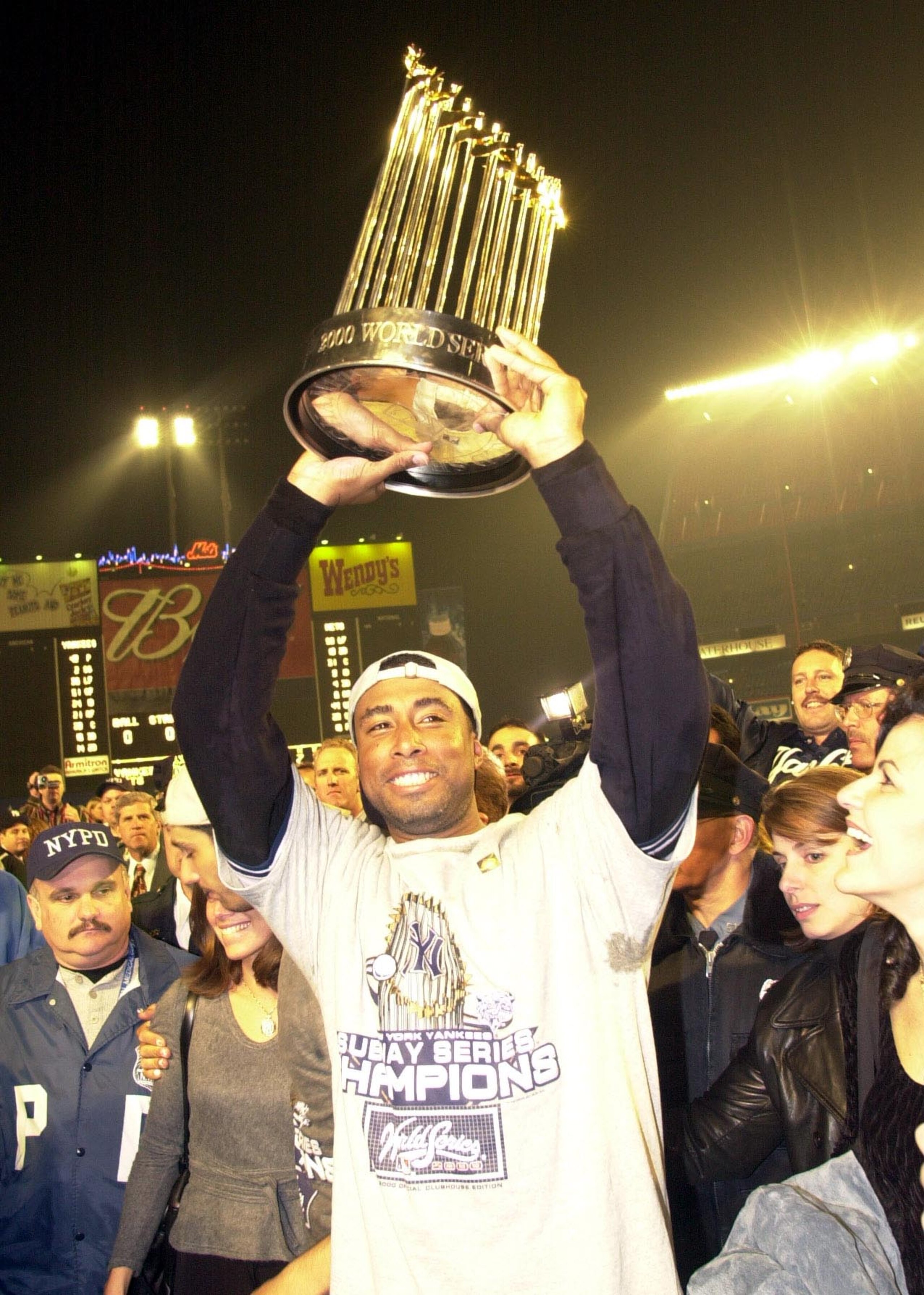 26 Oct 2000:  Bernie Williams of the New York Yankees celebrates the 4-2 win and World Series Championship over the New York Mets in five games during the World Series at Shea Stadium in Flushing, New York. <DIGITAL IMAGE> Mandatory Credit: Ezra Shaw/ALLS