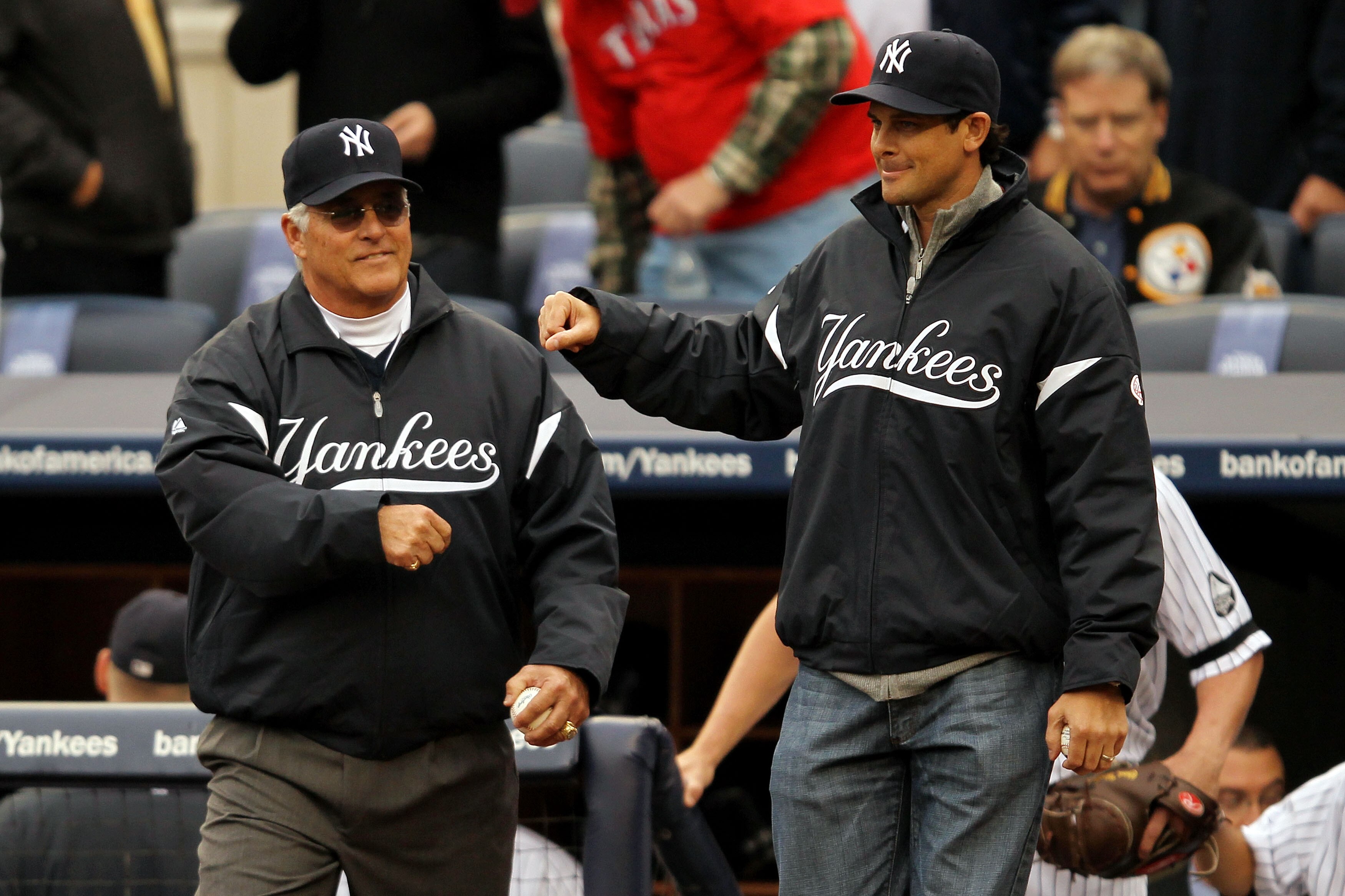 NEW YORK - OCTOBER 20:  (L-R) Former New York Yankees Bucky Dent and Aaron Boone walk onto the field to throw out the cermonial first pitch prior to the Yankees playing against the Texas Rangers in Game Five of the ALCS during the 2010 MLB Playoffs at Yan