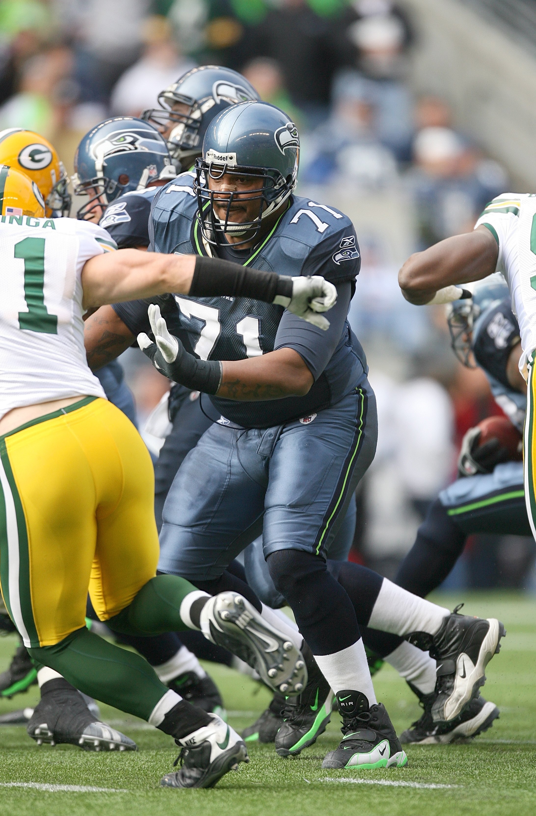 SEATTLE - OCTOBER 12:  Walter Jones #71 of the Seattle Seahawks picks up a block during the game against the Green Bay Packers on October 12, 2008 at Qwest Field in Seattle, Washington. The Packers defeated the Seahawks 27-17. (Photo by Otto Greule Jr./Ge