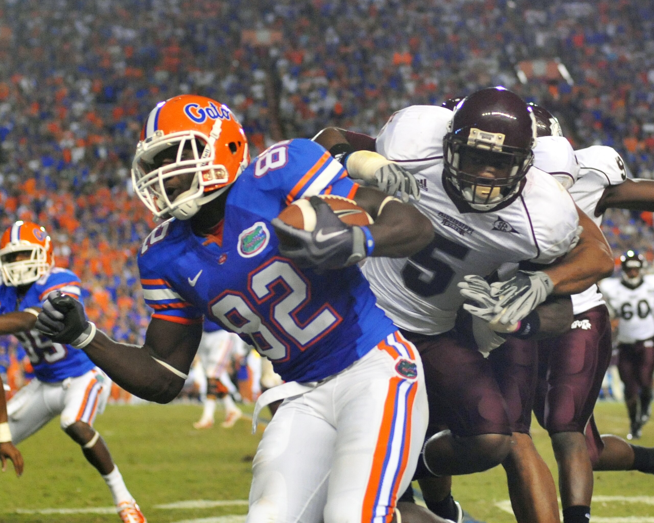 GAINESVILLE, FL - OCTOBER 16:  Wide receiver Omarius Hines #82 of the Florida Gators rushes upfield with a pass against the Mississippi State Bulldogs  October 16, 2010 Ben Hill Griffin Stadium at Gainesville, Florida.  (Photo by Al Messerschmidt/Getty Im