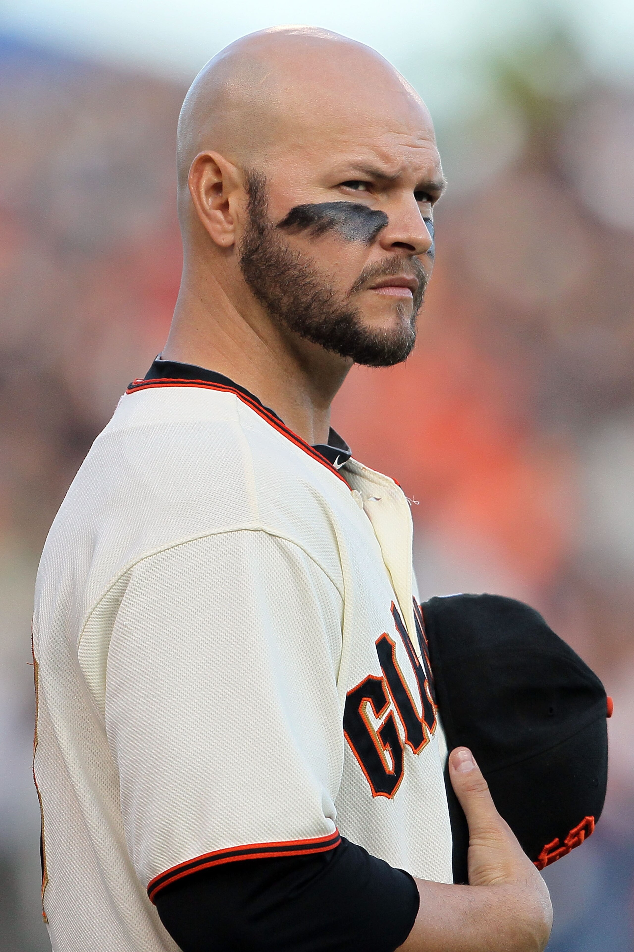 SAN FRANCISCO - OCTOBER 20:  Cody Ross #13 of the San Francisco Giants looks on during the national anthem before Game Four of the NLCS during the 2010 MLB Playoffs against the Philadelphia Phillies at AT&T Park on October 20, 2010 in San Francisco, Calif
