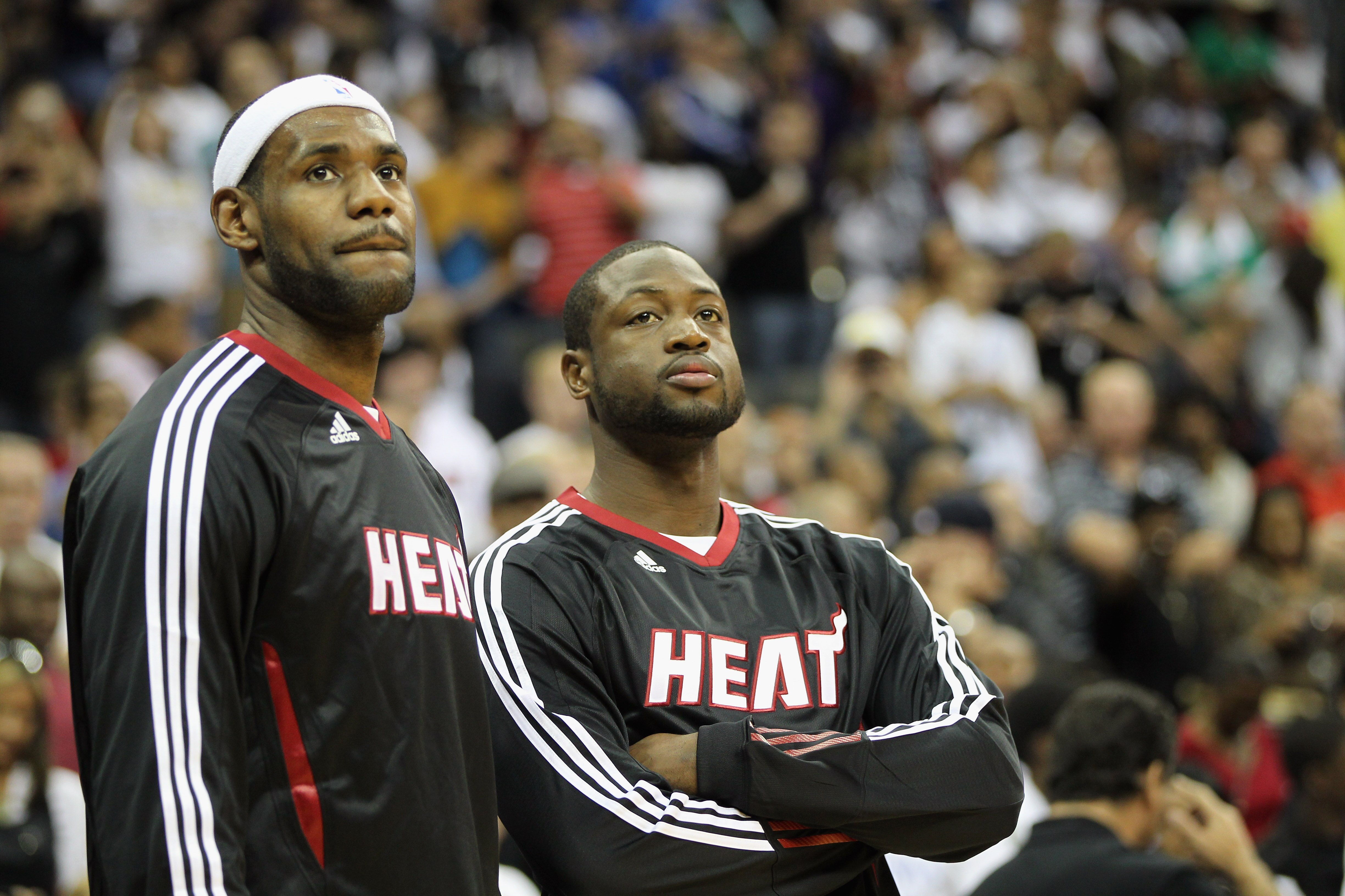 KANSAS CITY, MO - OCTOBER 08:  Lebron James #6 of the Miami Heat looks on during warm-ups alongside Dwayne Wade #3 prior to the game against the Oklahoma City Thunder on October 8, 2010 at the Sprint Center in Kansas City, Missouri.  (Photo by Jamie Squir