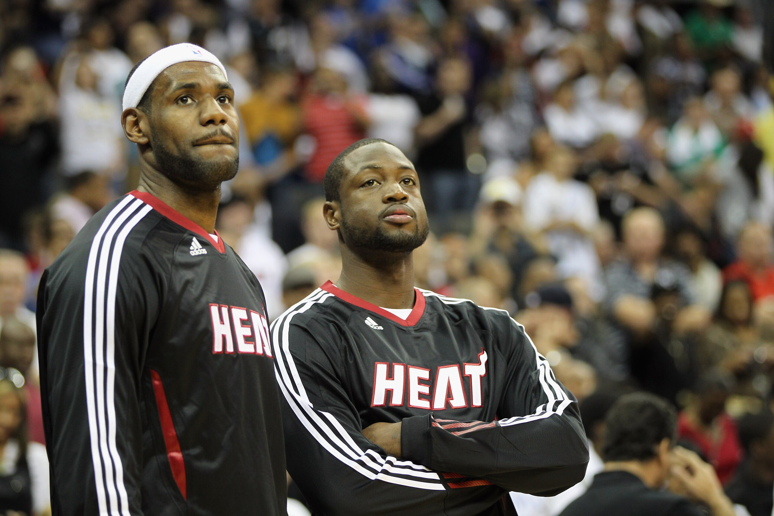 KANSAS CITY, MO - OCTOBER 08:  Lebron James #6 of the Miami Heat looks on during warm-ups alongside Dwayne Wade #3 prior to the game against the Oklahoma City Thunder on October 8, 2010 at the Sprint Center in Kansas City, Missouri.  (Photo by Jamie Squir