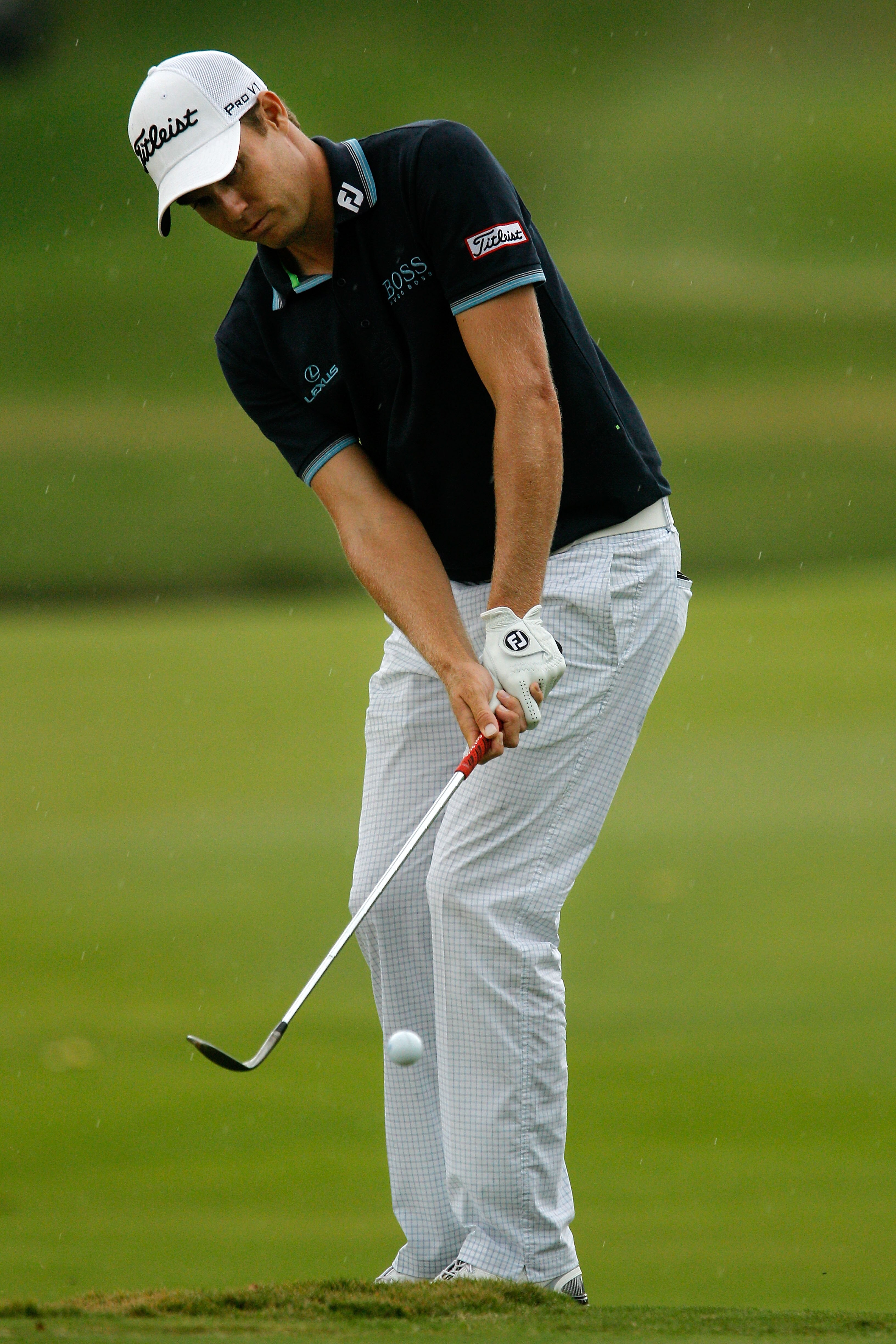 ATLANTA - SEPTEMBER 26:  Nick Watney chips to make eagle on the ninth hole during the final round of THE TOUR Championship presented by Coca-Cola at East Lake Golf Club on September 26, 2010 in Atlanta, Georgia.  (Photo by Scott Halleran/Getty Images)