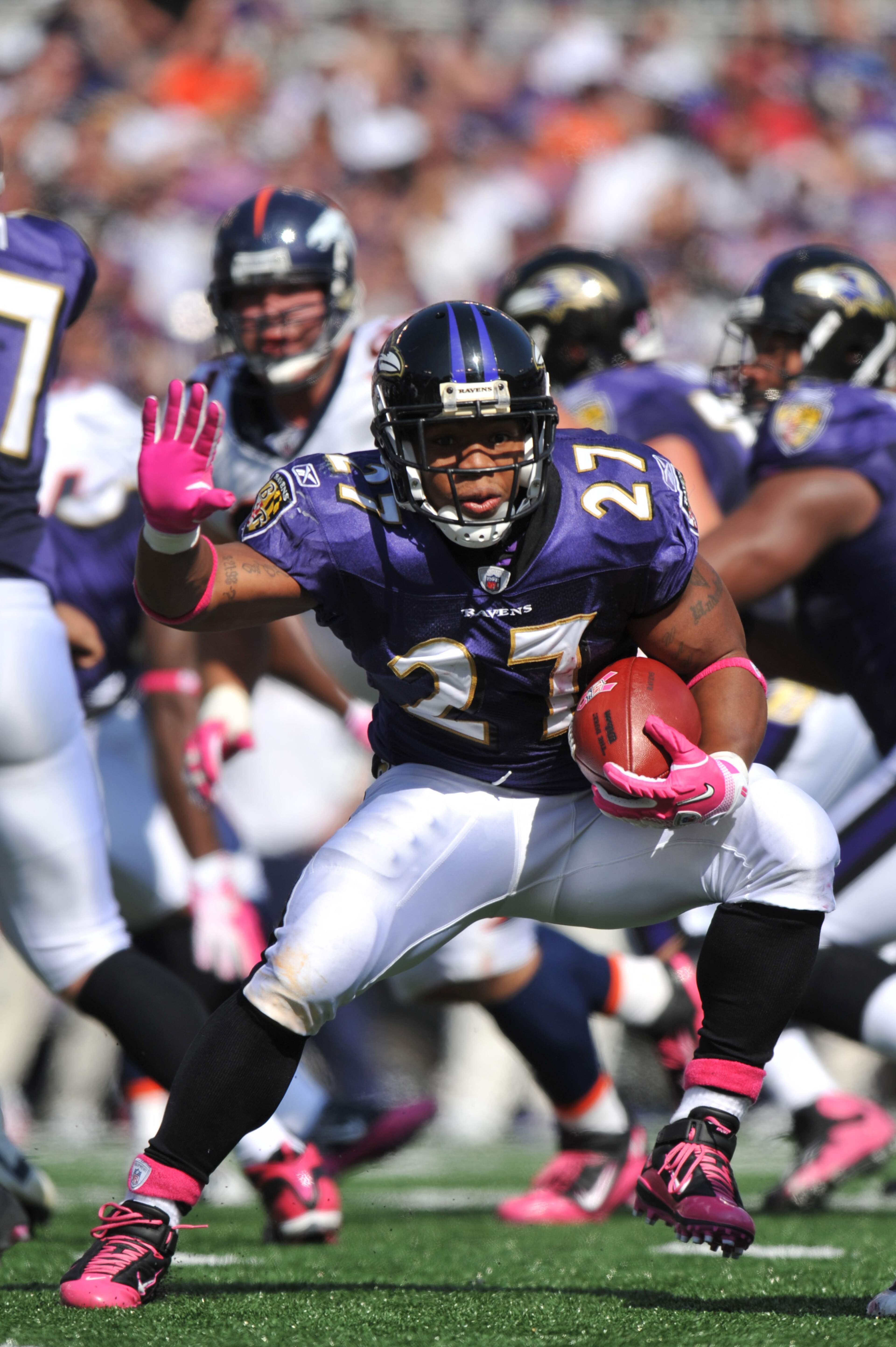 BALTIMORE, MD - OCTOBER 10: Ray Rice #27 of the Baltimore Ravens runs the ball against the Denver Broncos at M&T Bank Stadium on October 10, 2010 in Baltimore, Maryland. Players wore pink in recognition of Breast Cancer Awareness Month. The Ravens defeate BALTIMORE, MD - OCTOBER 10: Ray Rice #27 of the Baltimore Ravens runs the ball against the Denver Broncos at M&T Bank Stadium on October 10, 2010 in Baltimore, Maryland. Players wore pink in recognition of Breast Cancer Awareness Month. The Ravens defeate