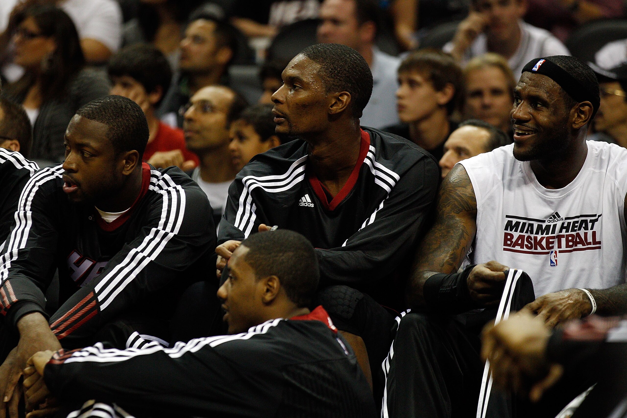 SAN ANTONIO - OCTOBER 09:  Dwayne Wade #3, Chris Bosh #1 and LeBron James #6 of the Miami Heat sit on the bench during the game against the San Antonio Spurs at the AT&T Center on October 9, 2010 in San Antonio, Texas.  NOTE TO USER: User expressly acknow