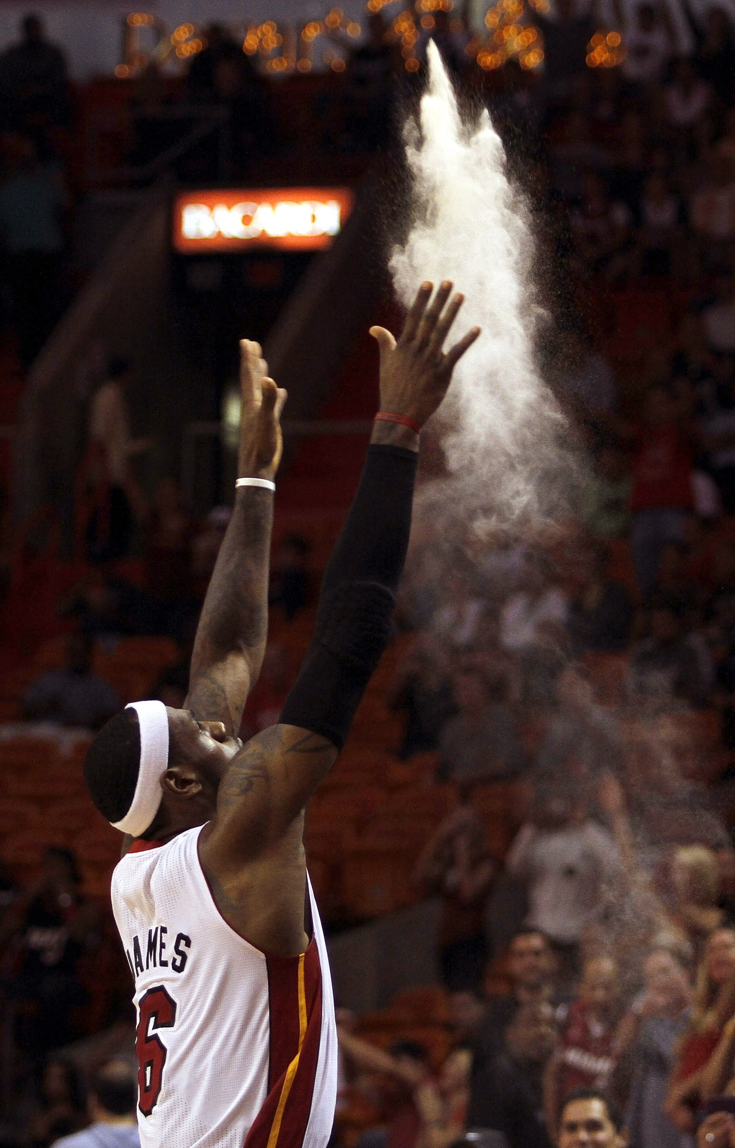 MIAMI - OCTOBER 18:  Forward LeBron James #6 of the Miami Heat prepares to face the Charlotte Bobcats on October 18, 2010 at American Airlines Arena in Miami, Florida. NOTE TO USER: User expressly acknowledges and agrees that, by downloading and/or using