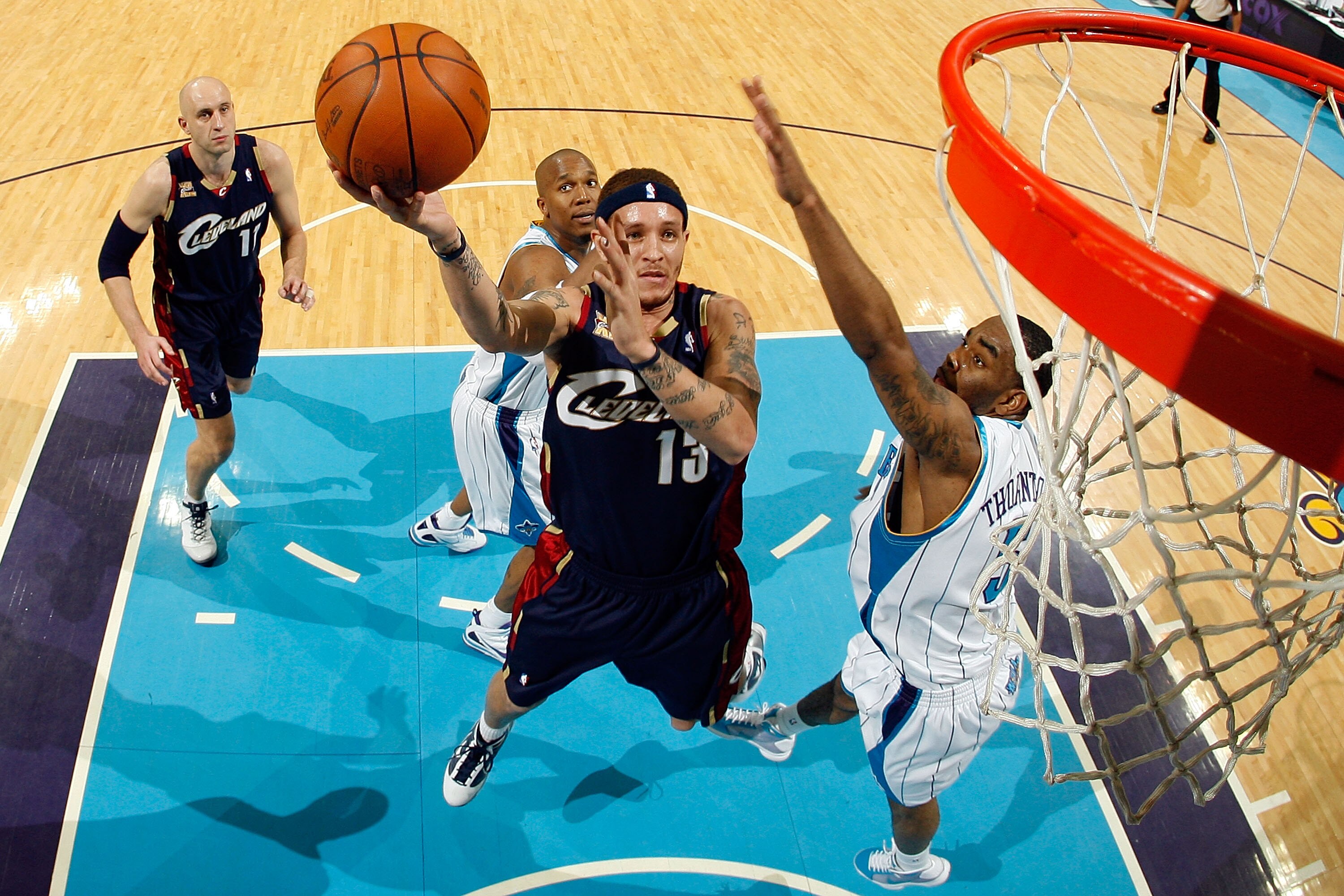 NEW ORLEANS - MARCH 24:  Delonte West #13 of the Cleveland Cavaliers shoots the ball around Marcus Thornton #5 of the New Orleans Hornets at the New Orleans Arena on March 24, 2010 in New Orleans, Louisiana.  The Cavaliers defeated the Hornets 105-92.  NO
