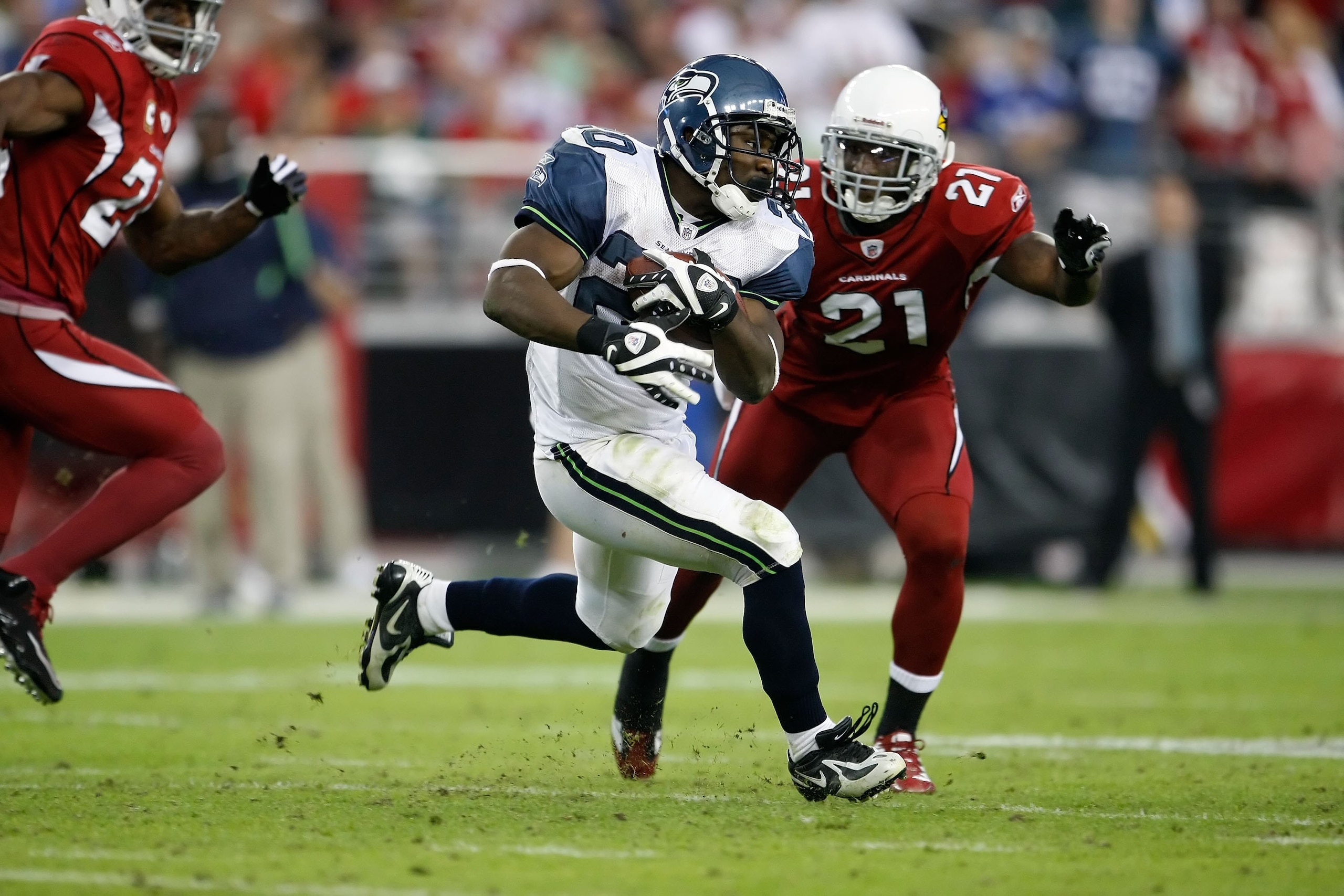 GLENDALE, AZ - NOVEMBER 15:  Justin Forsett #20 of the Seattle Seahawks carries the ball while being pursued by Antrel Rolle #21 of the Arizona Cardinals at University of Phoenix Stadium on November 15, 2009 in Glendale, Arizona.  (Photo by Jeff Gross/Get