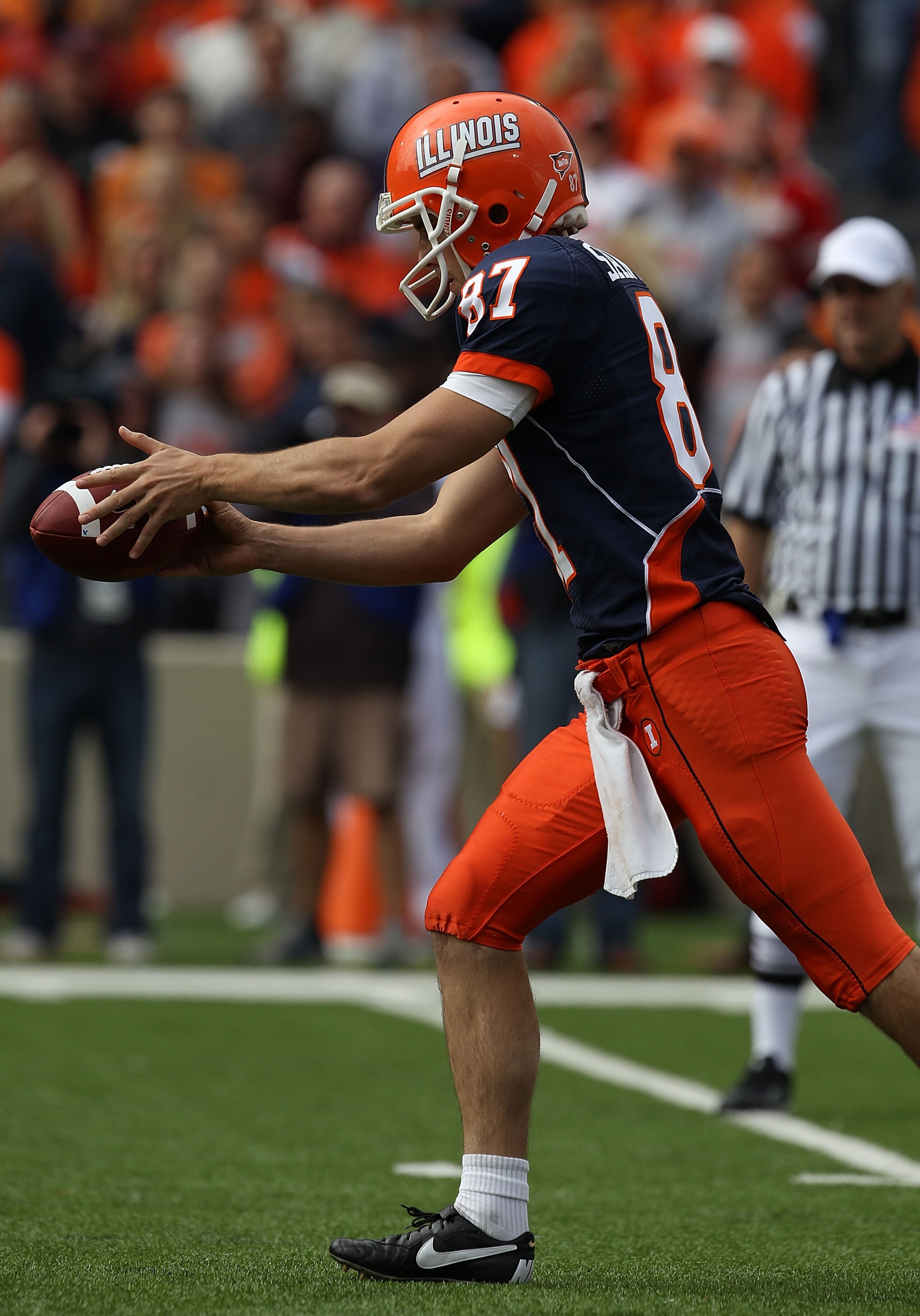 CHAMPAIGN, IL - OCTOBER 02: Anthony Santella #87 of the Illinois Fighting Illini punts the ball against the Ohio State Buckeyes at Memorial Stadium on October 2, 2010 in Champaign, Illinois. Ohio State defeated Illinois 24-13. (Photo by Jonathan Daniel/Ge