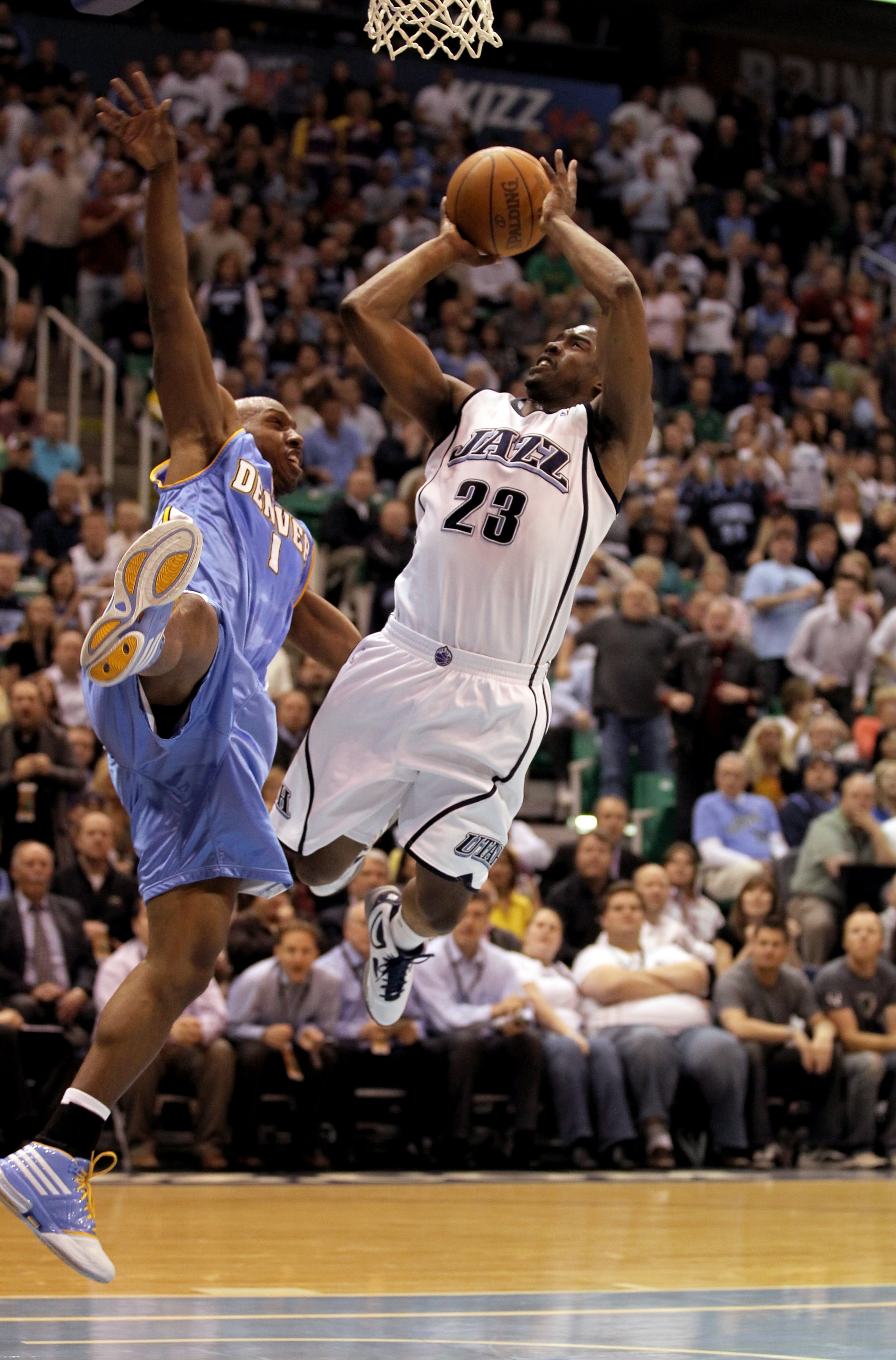 SALT LAKE CITY - APRIL 30:  Wesley Matthews #23 of the Utah Jazz shoots over Chauncey Billups #1 of the Denver Nuggets during Game Six of the Western Conference Quarterfinals of the 2010 NBA Playoffs at EnergySolutions Arena on April 30, 2010 in Salt Lake