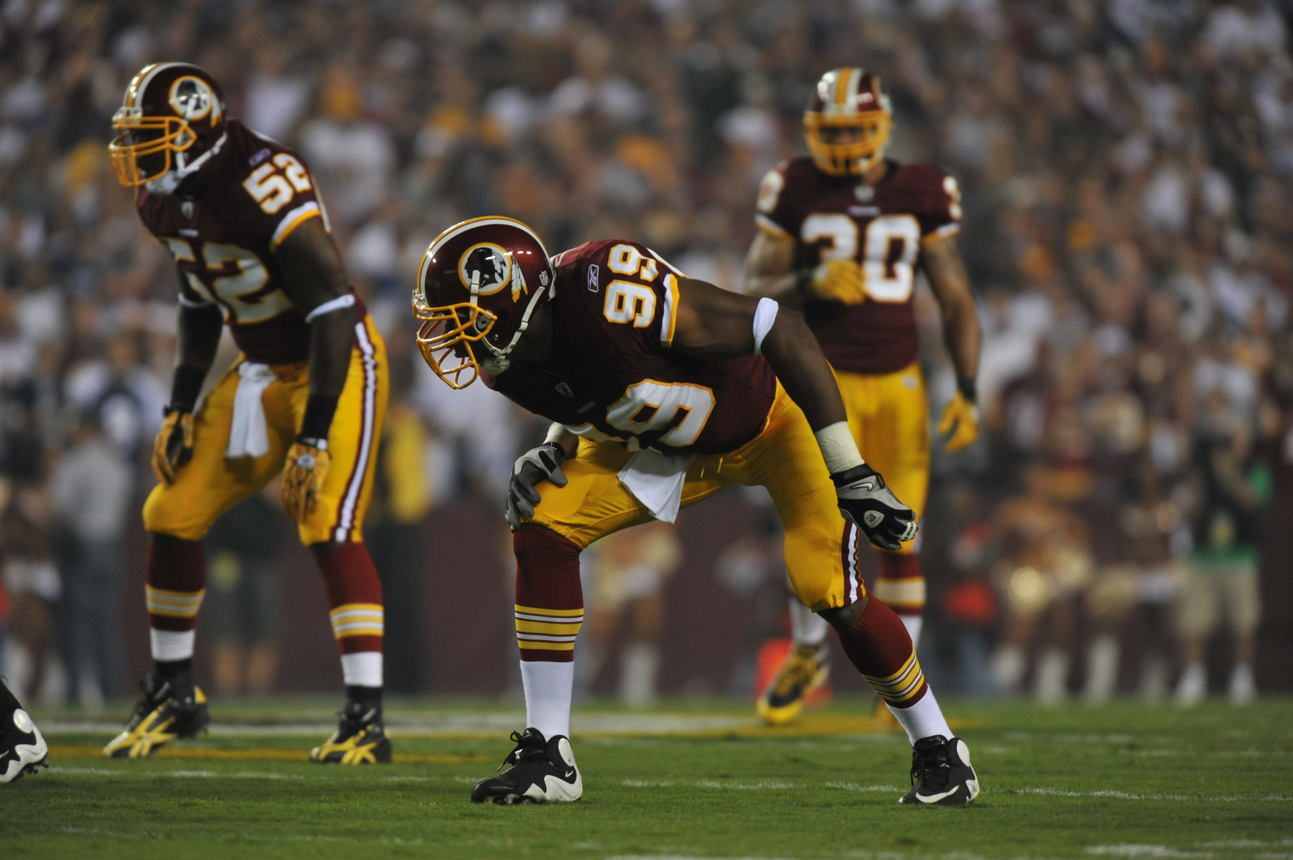 LANDOVER - SEPTEMBER 12:  Andre Carter #99 of the Washington Redskins defends during the NFL season opener against the Dallas Cowboys at FedExField on September 12, 2010 in Landover, Maryland. The Redskins defeated the Cowboys 13-7. (Photo by Larry French
