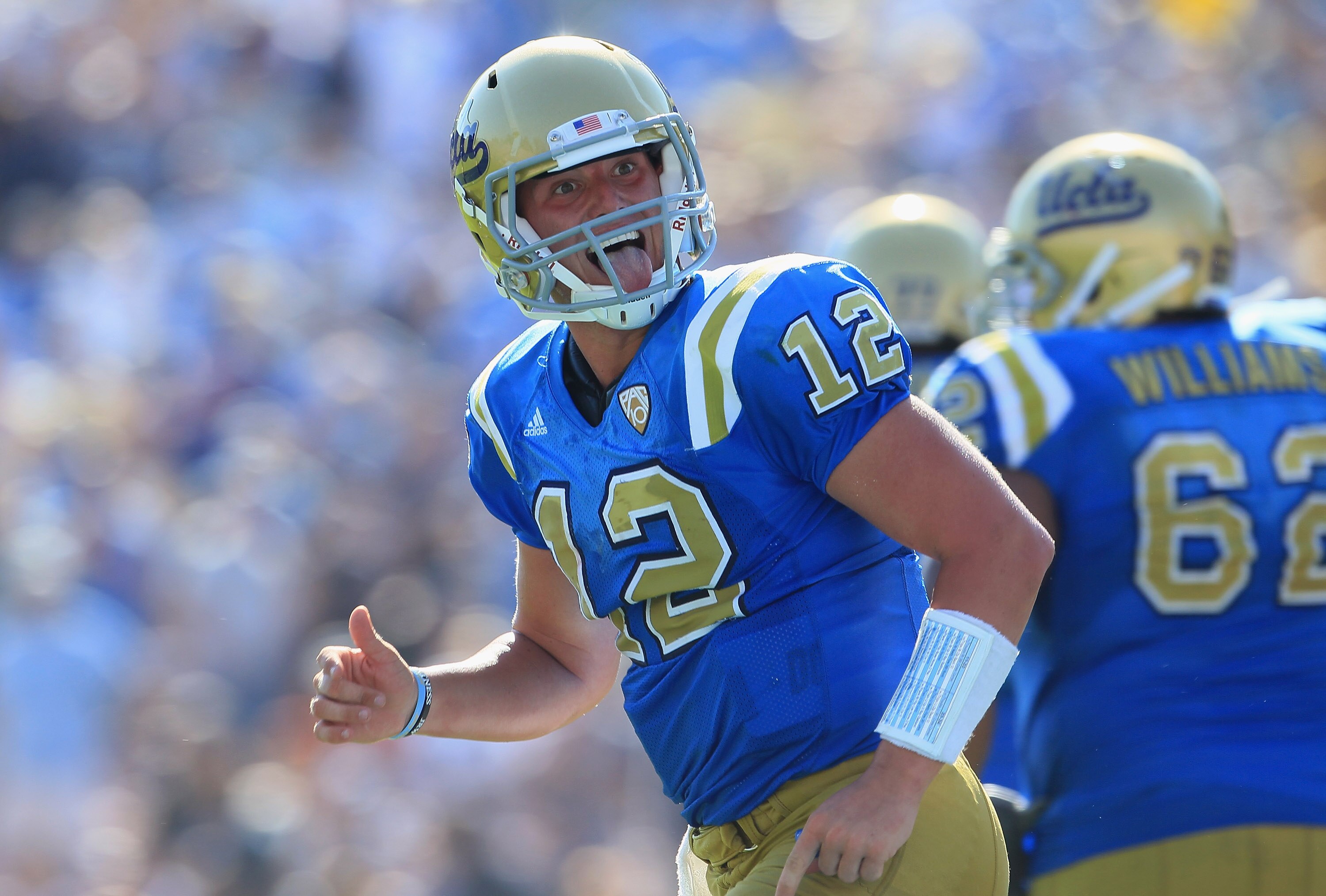 PASADENA, CA - OCTOBER 02:  Quarterback Richard Brehaut #12 of the UCLA Bruins celebrates a touchdown against the Washington State Cougars during the fourth quarter at the Rose Bowl on October 2, 2010 in Pasadena, California. UCLA defeated Washington Stat