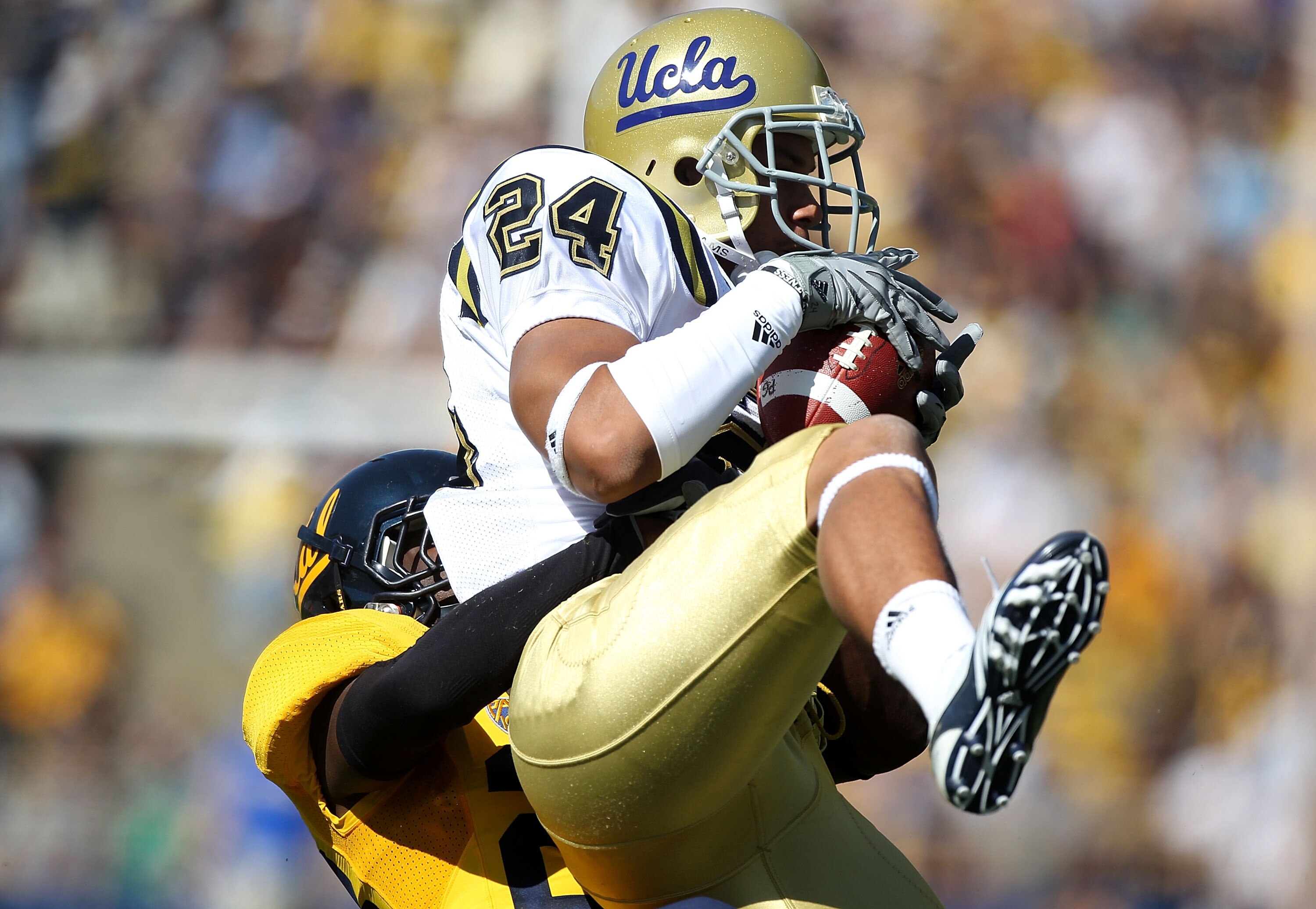 BERKELEY, CA - OCTOBER 09:  Christian Ramirez #24 the UCLA Bruins catches a pass against the California Golden Bears at California Memorial Stadium on October 9, 2010 in Berkeley, California.  (Photo by Jed Jacobsohn/Getty Images)
