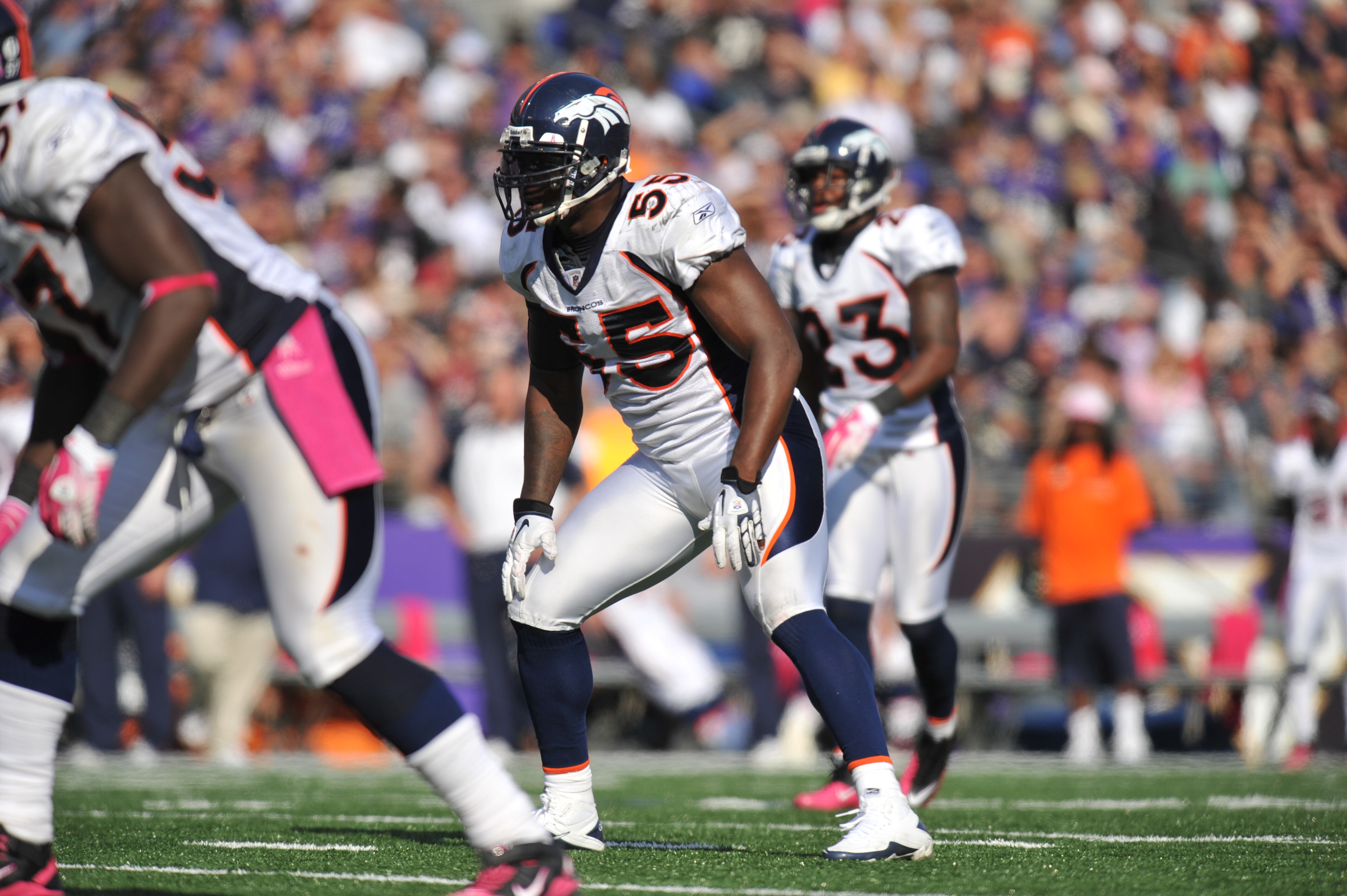 BALTIMORE, MD - OCTOBER 10: D. J. Williams #55 of the Denver Broncos defends against the Baltimore Ravens at M&T Bank Stadium on October 10, 2010 in Baltimore, Maryland. Players wore pink in recognition of Breast Cancer Awareness Month. The Ravens defeate BALTIMORE, MD - OCTOBER 10: D. J. Williams #55 of the Denver Broncos defends against the Baltimore Ravens at M&T Bank Stadium on October 10, 2010 in Baltimore, Maryland. Players wore pink in recognition of Breast Cancer Awareness Month. The Ravens defeate